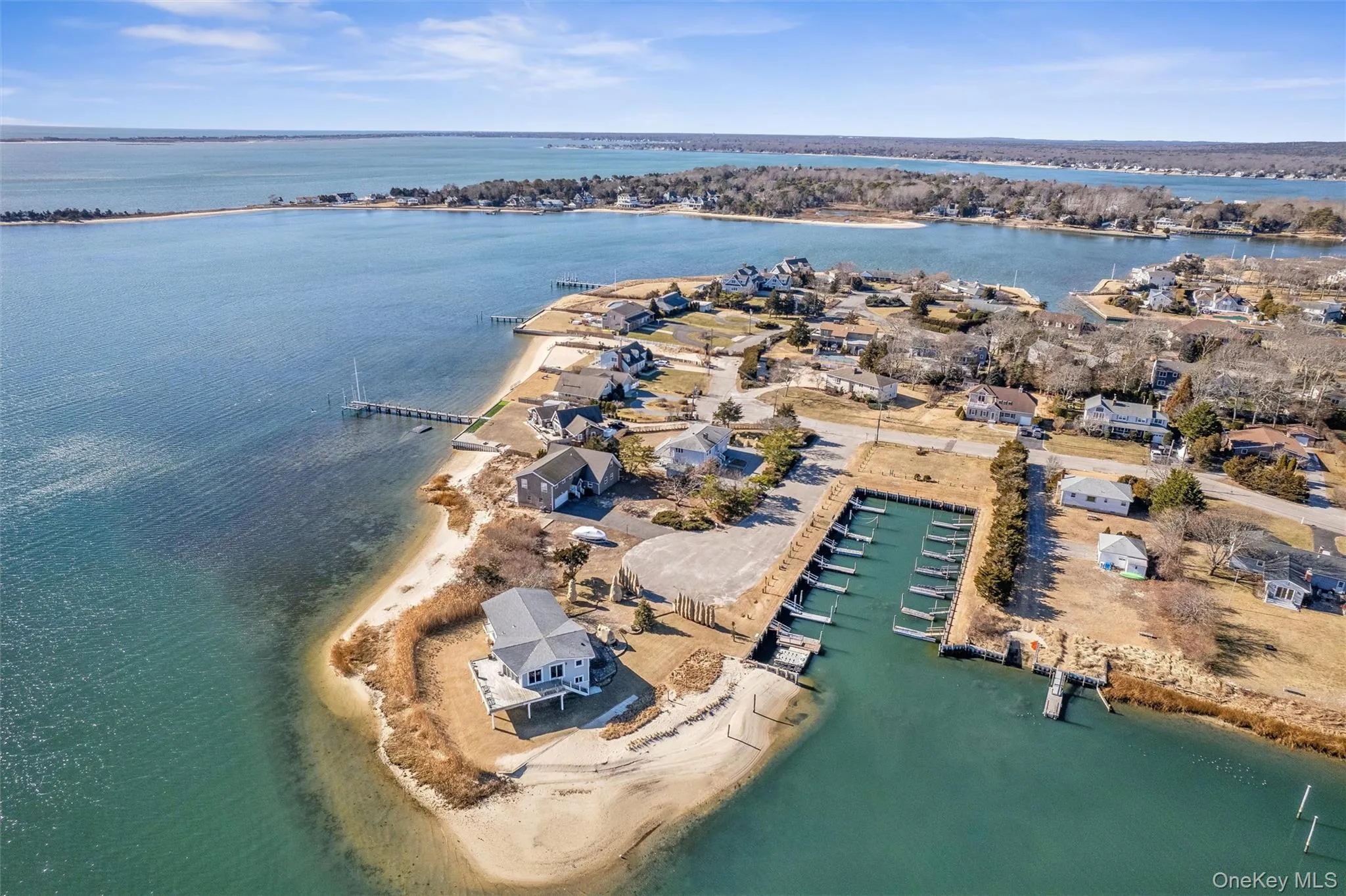 Bird's eye view featuring a view of the beach and a water view Bird's eye view featuring a view of the beach and a water view
