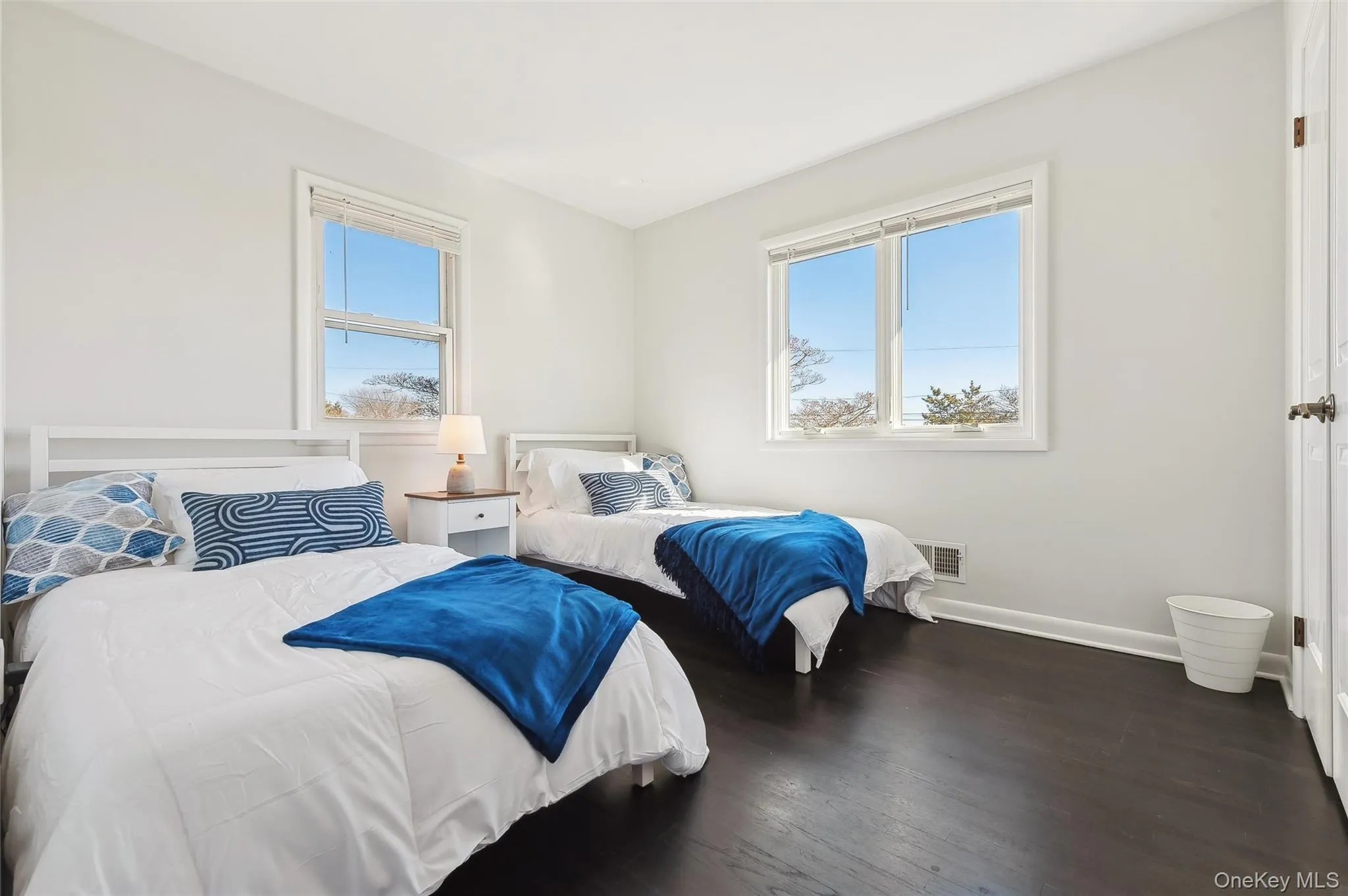 Bedroom with dark hardwood / wood-style flooring Bedroom with dark hardwood / wood-style flooring