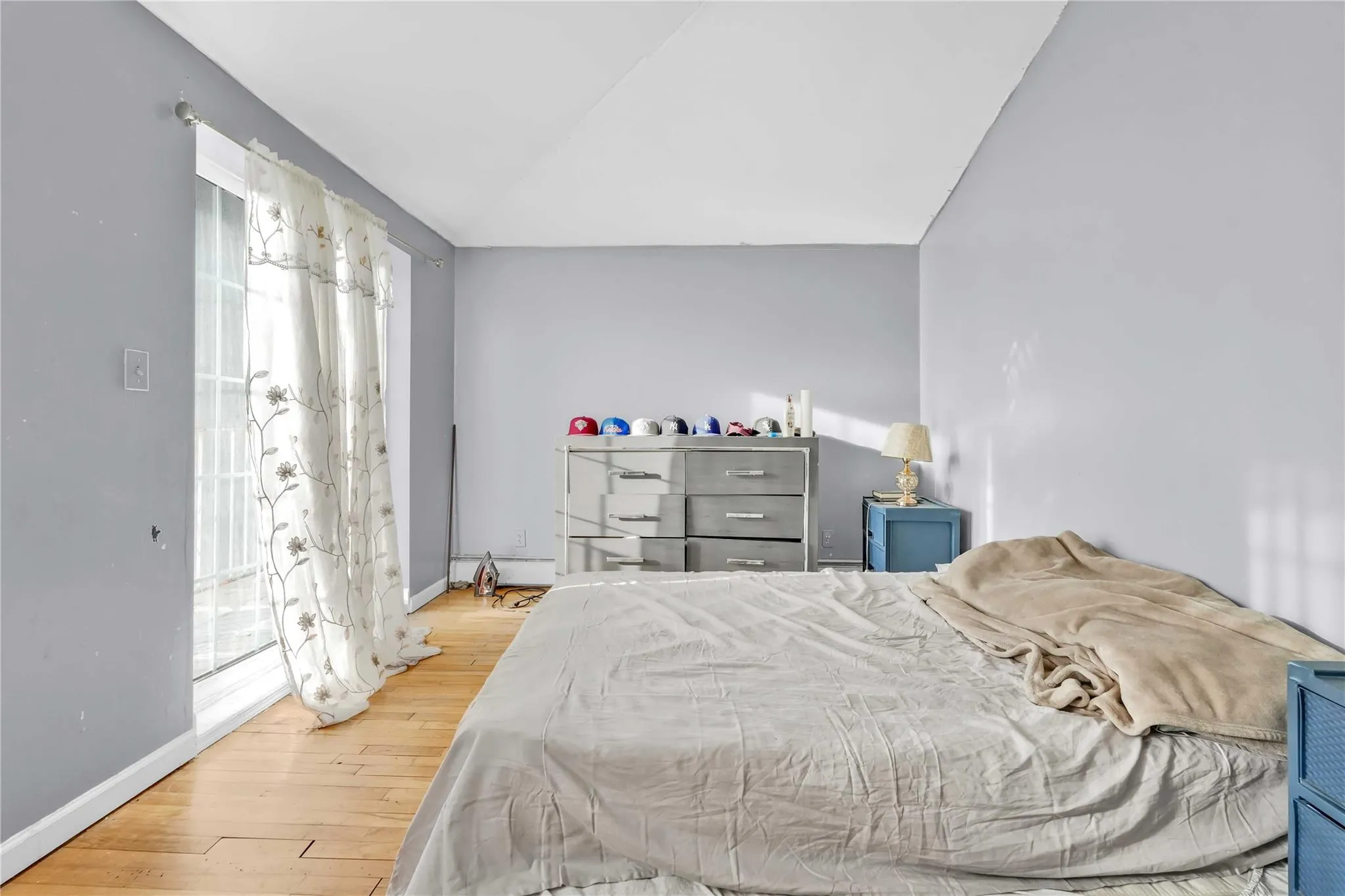 Bedroom with lofted ceiling and wood-type flooring Bedroom with lofted ceiling and wood-type flooring