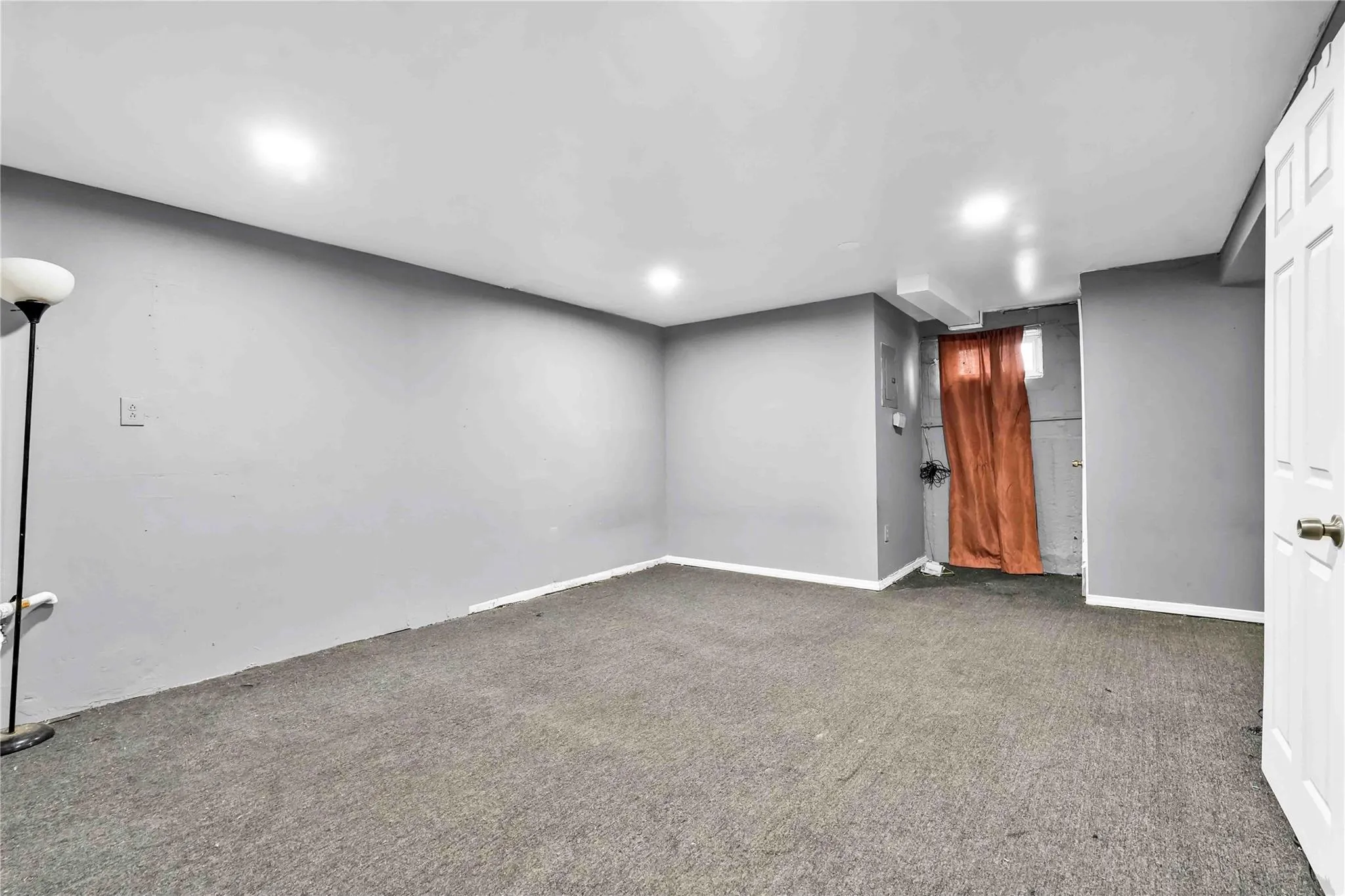 Basement with dark colored carpet Basement with dark colored carpet