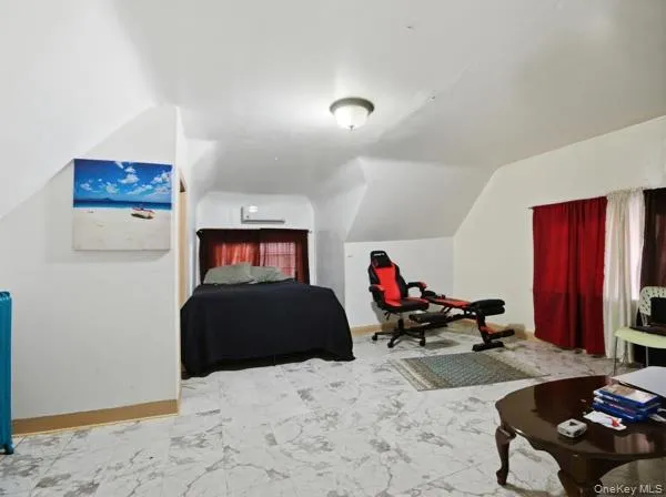 Bedroom with lofted ceiling Bedroom with lofted ceiling