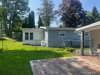 Rear view of house with an attached deck Rear view of house with an attached deck