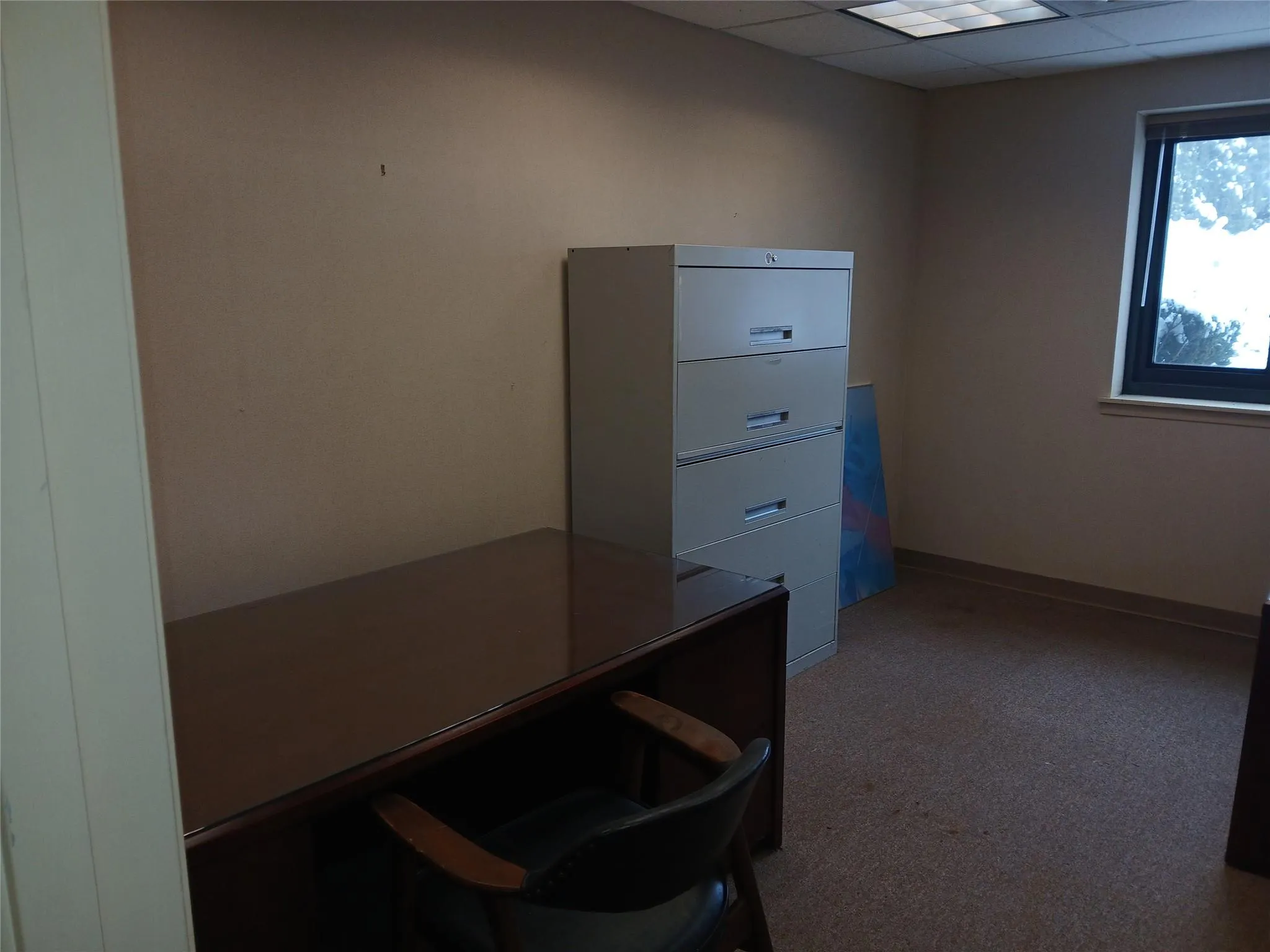 Office space featuring a drop ceiling Office space featuring a drop ceiling