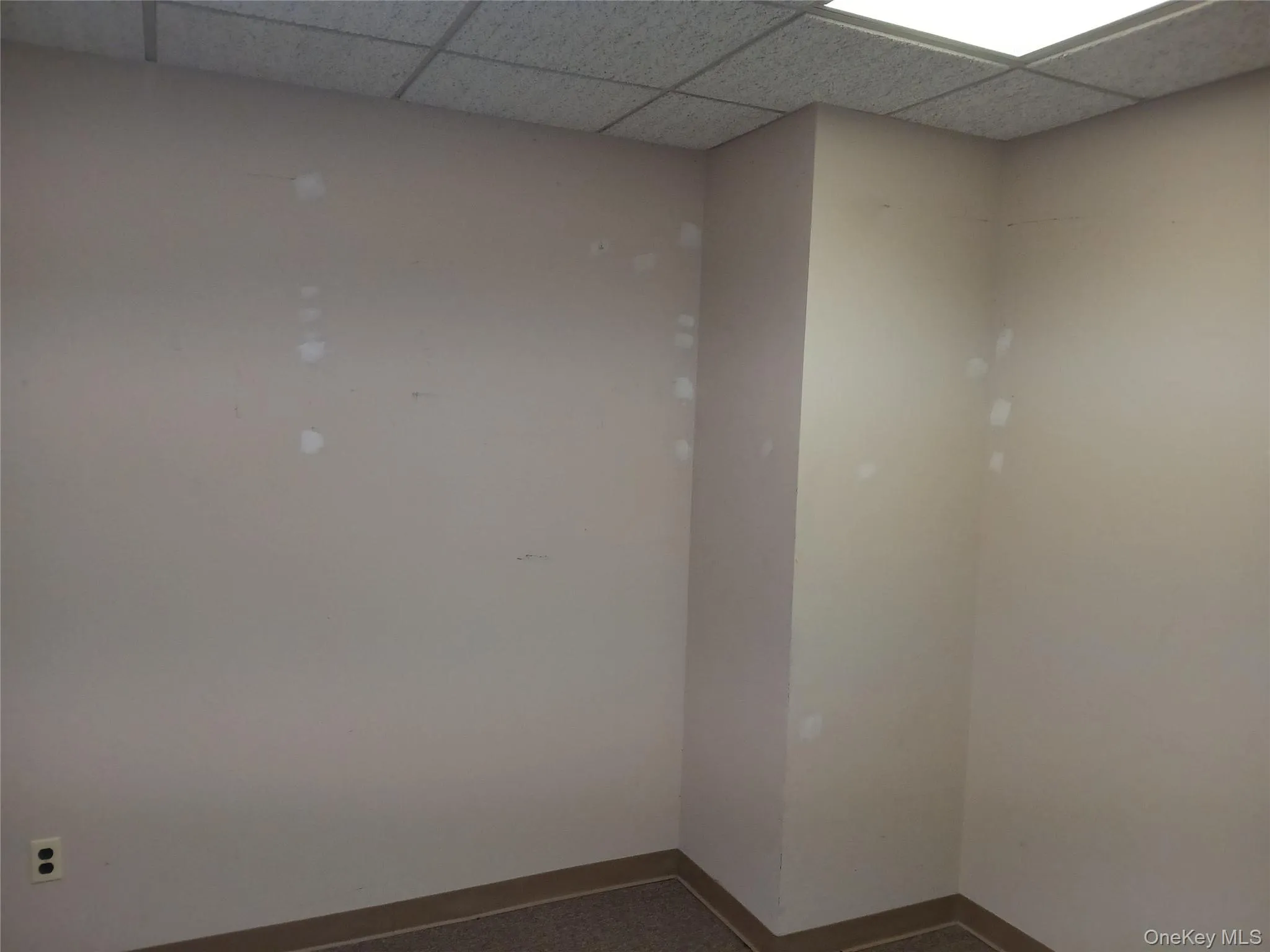 Spare room featuring a paneled ceiling Spare room featuring a paneled ceiling