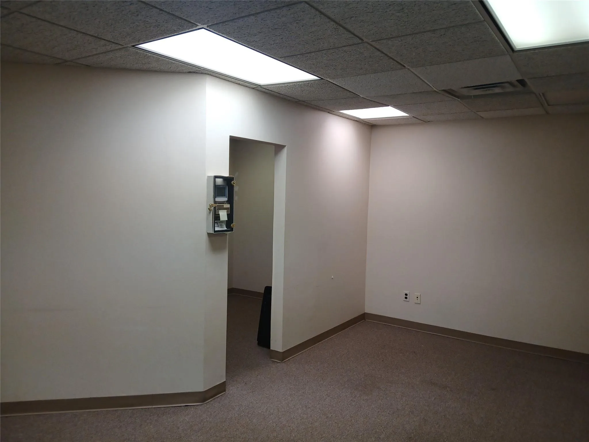 Empty room with a paneled ceiling Empty room with a paneled ceiling