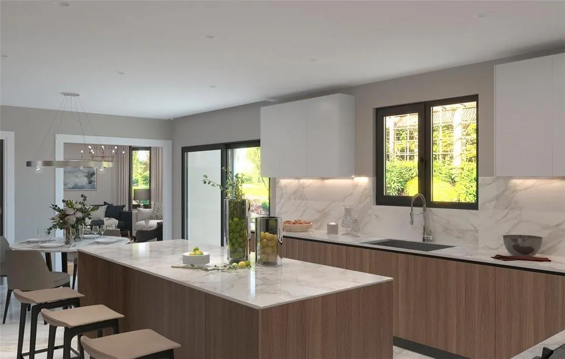 Kitchen featuring backsplash, a kitchen bar, white cabinetry, and sink Kitchen featuring backsplash, a kitchen bar, white cabinetry, and sink