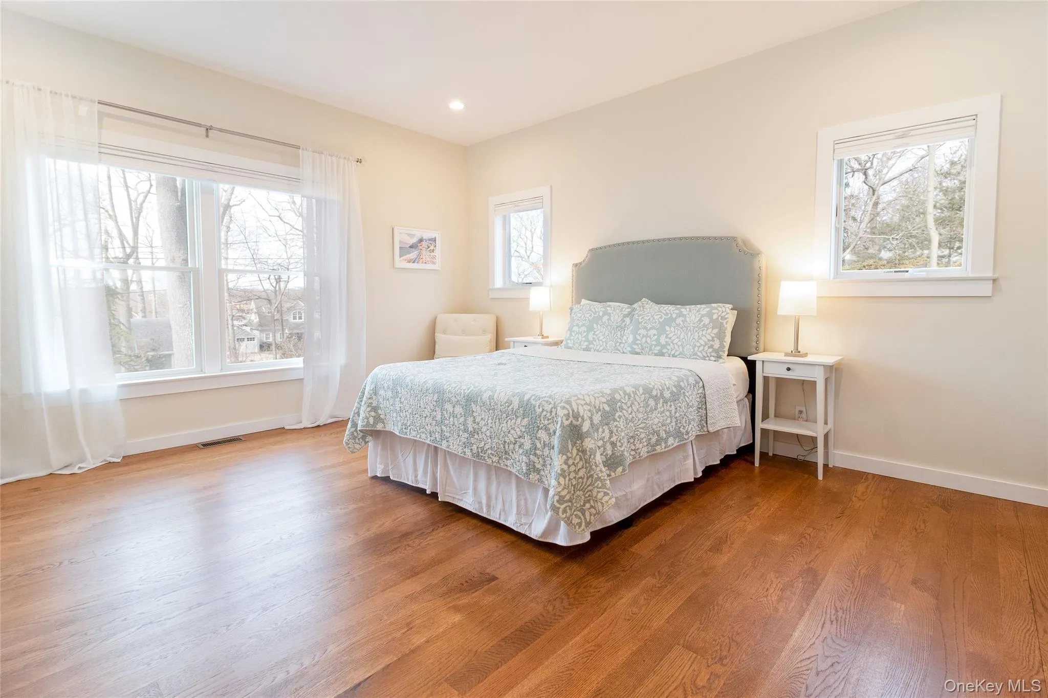 Bedroom featuring hardwood / wood-style flooring Bedroom featuring hardwood / wood-style flooring