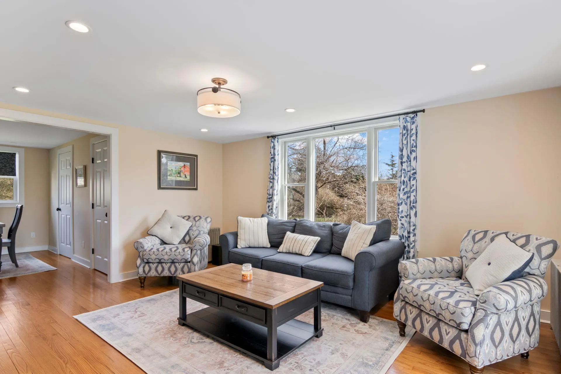 Living room featuring hardwood / wood-style flooring Living room featuring hardwood / wood-style flooring