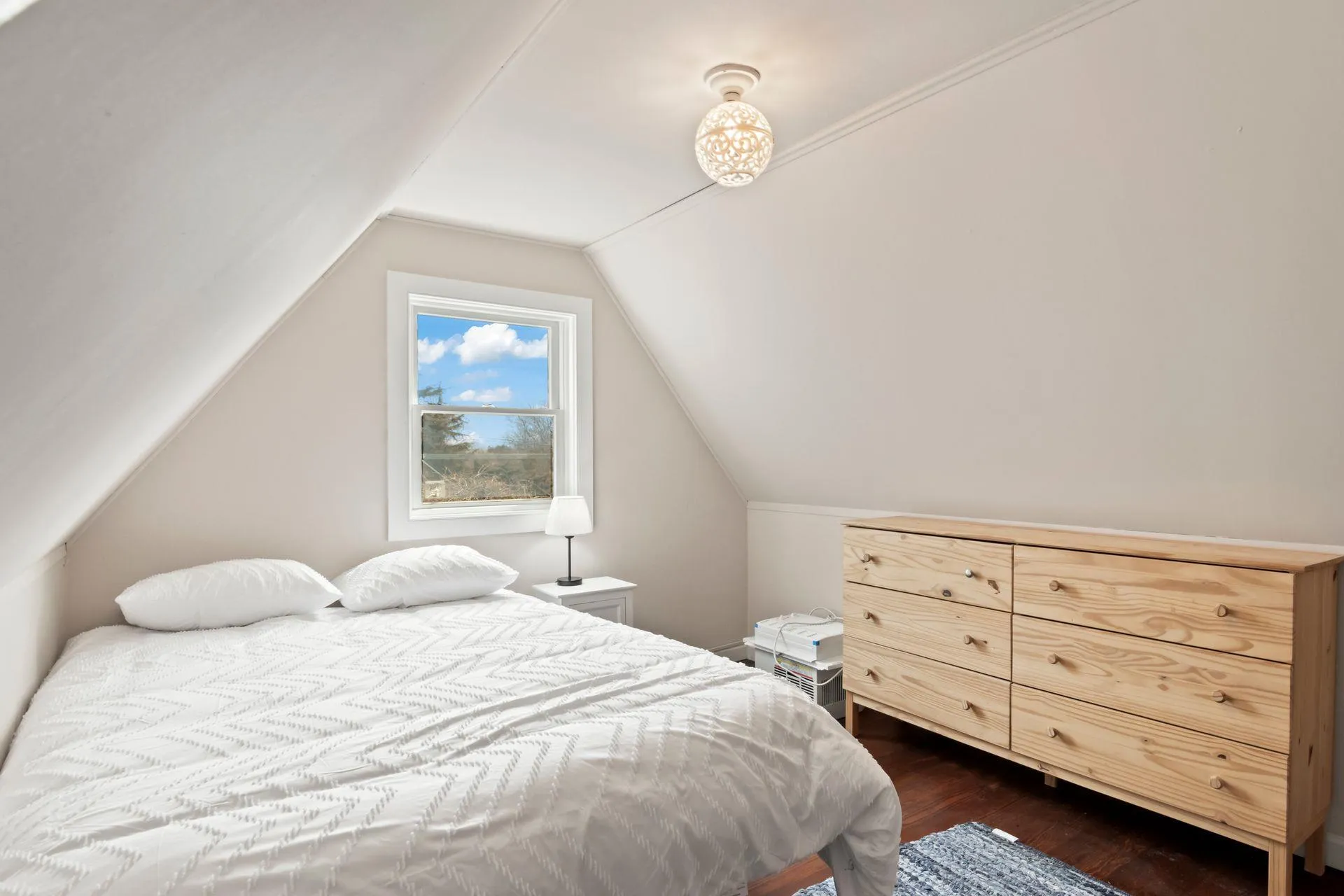 Bedroom with lofted ceiling and dark wood-type flooring Bedroom with lofted ceiling and dark wood-type flooring