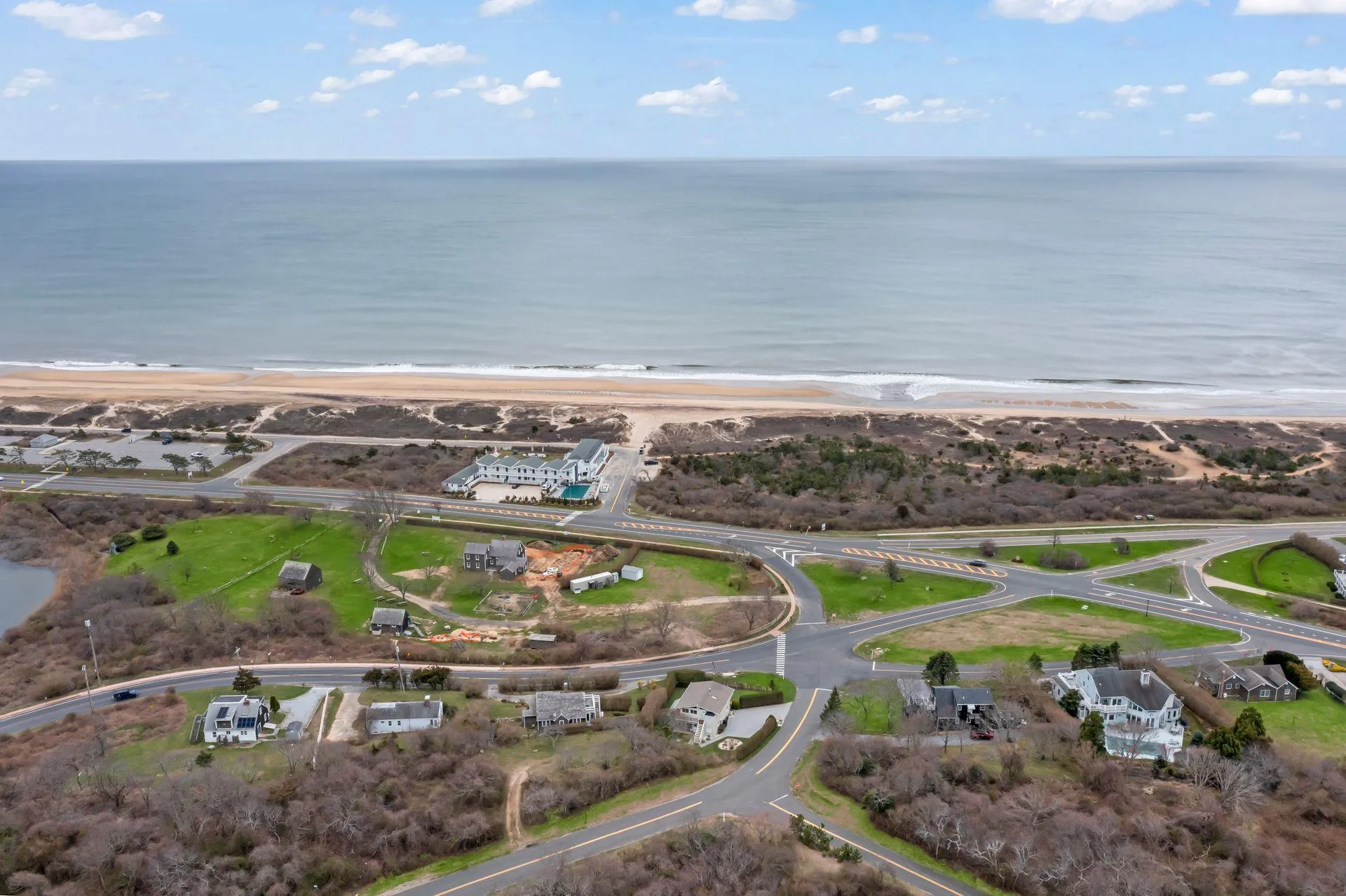 Drone / aerial view with a water view and a beach view Drone / aerial view with a water view and a beach view