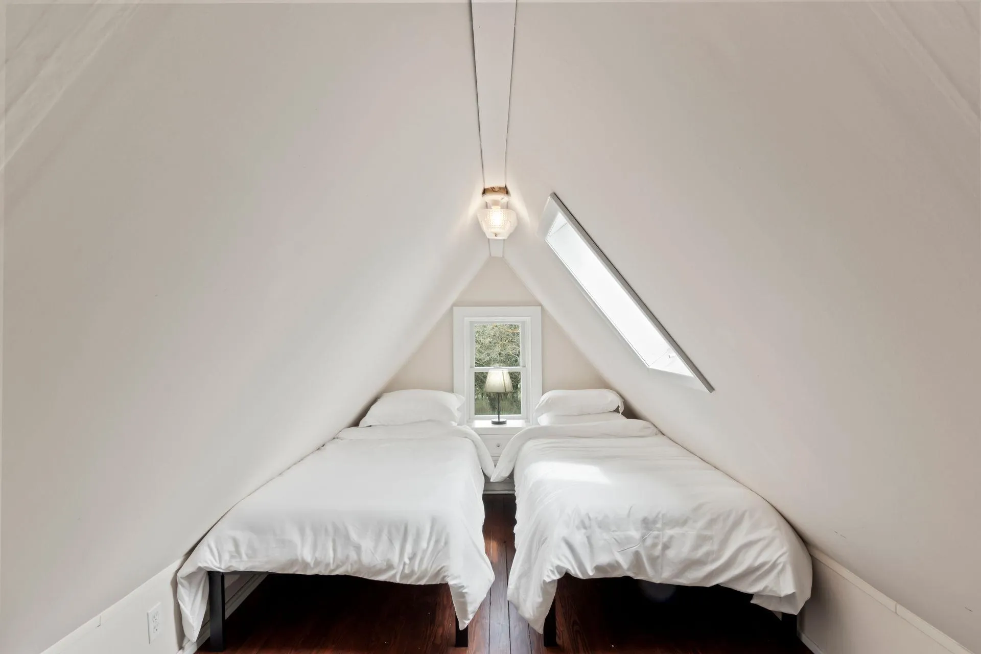 Bedroom with vaulted ceiling and hardwood / wood-style floors Bedroom with vaulted ceiling and hardwood / wood-style floors