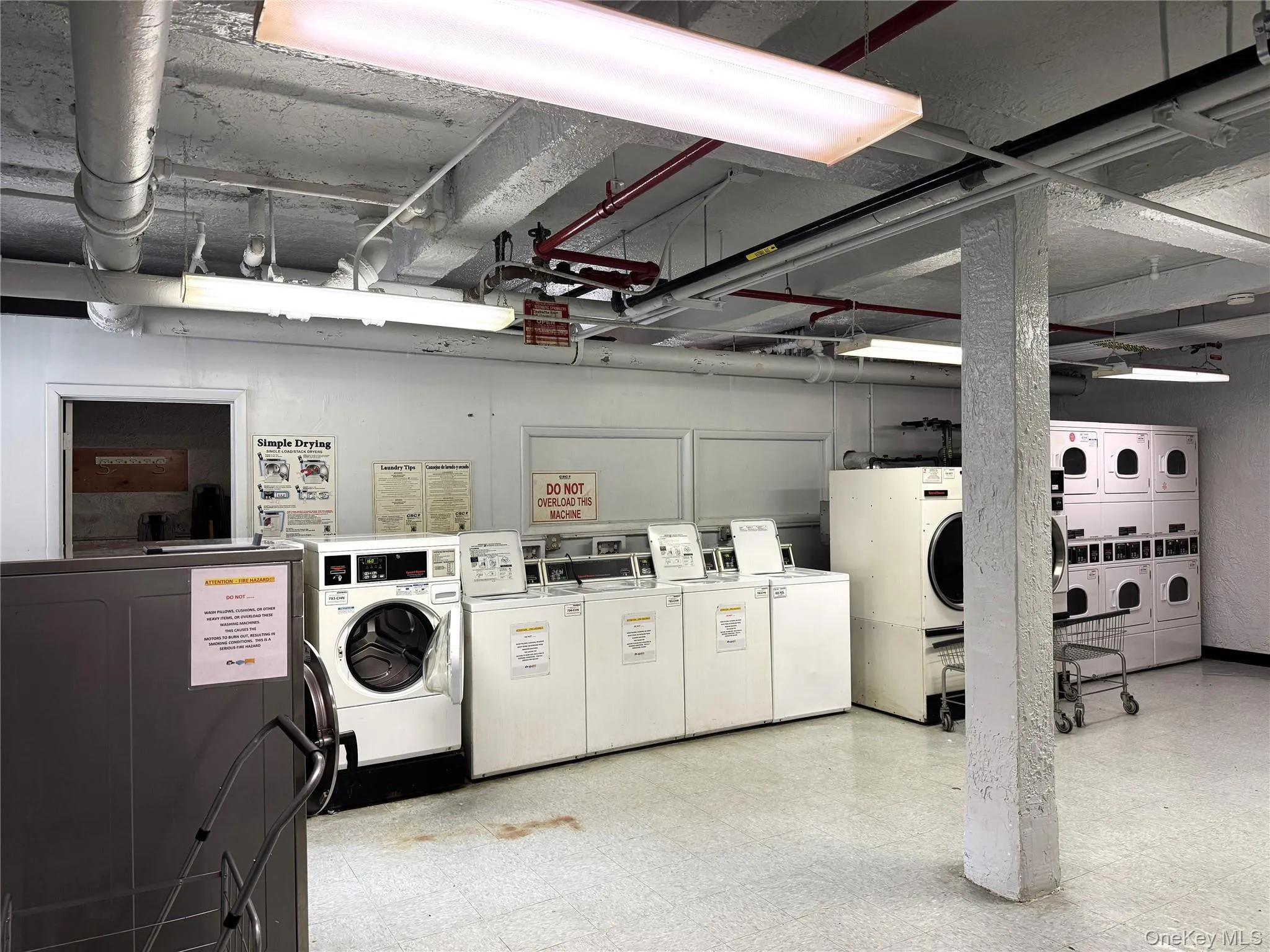 Washroom with washing machine and clothes dryer and stacked washing maching and dryer Washroom with washing machine and clothes dryer and stacked washing maching and dryer