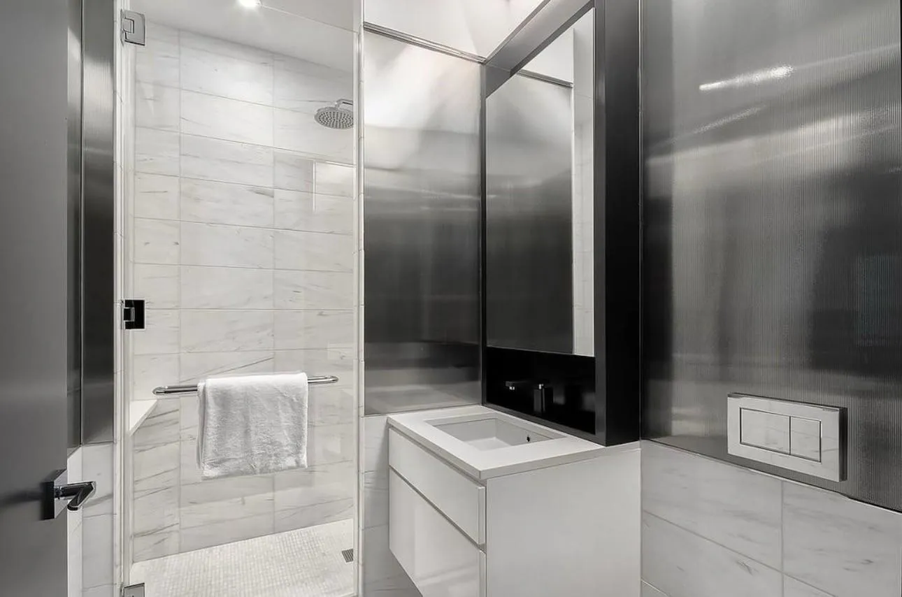 Bathroom with vanity and a shower with shower door Bathroom with vanity and a shower with shower door