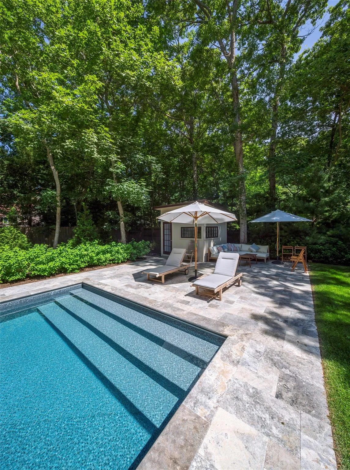View of swimming pool featuring an outdoor hangout area, an outdoor structure, and a patio area View of swimming pool featuring an outdoor hangout area, an outdoor structure, and a patio area