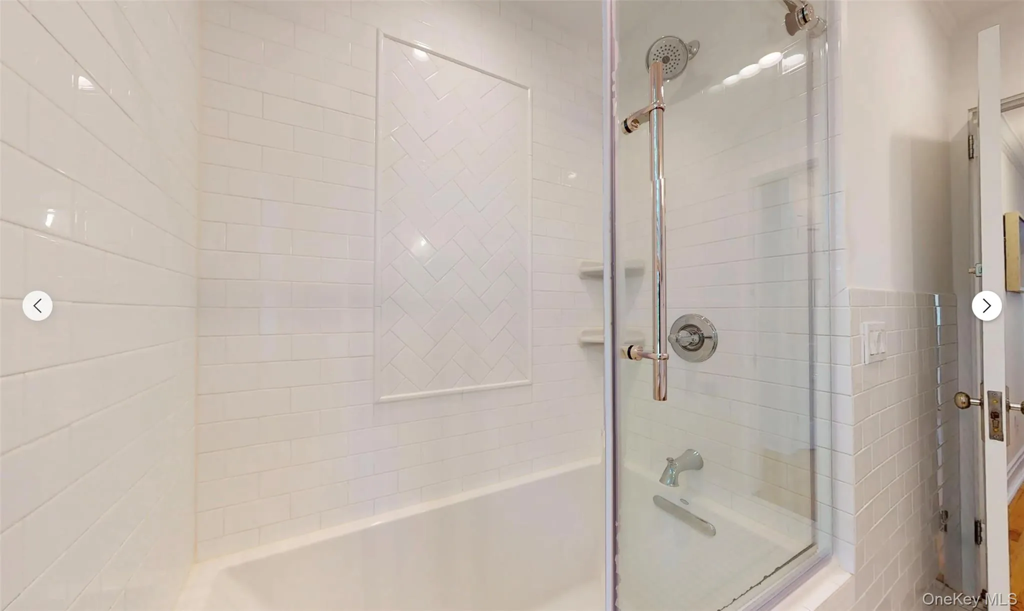 Bathroom featuring shower / bath combination with glass door Bathroom featuring shower / bath combination with glass door
