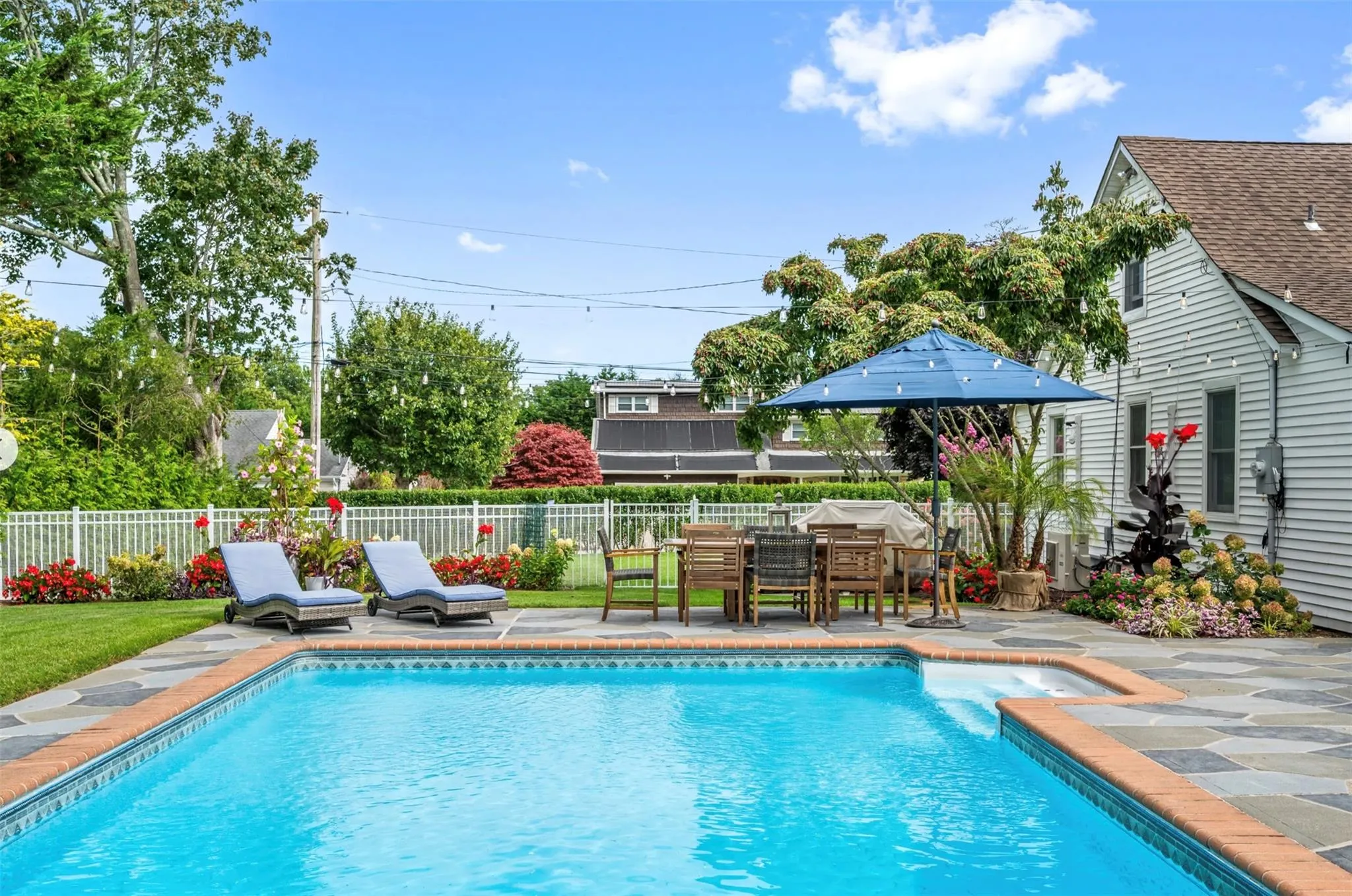 View of pool with a patio area View of pool with a patio area