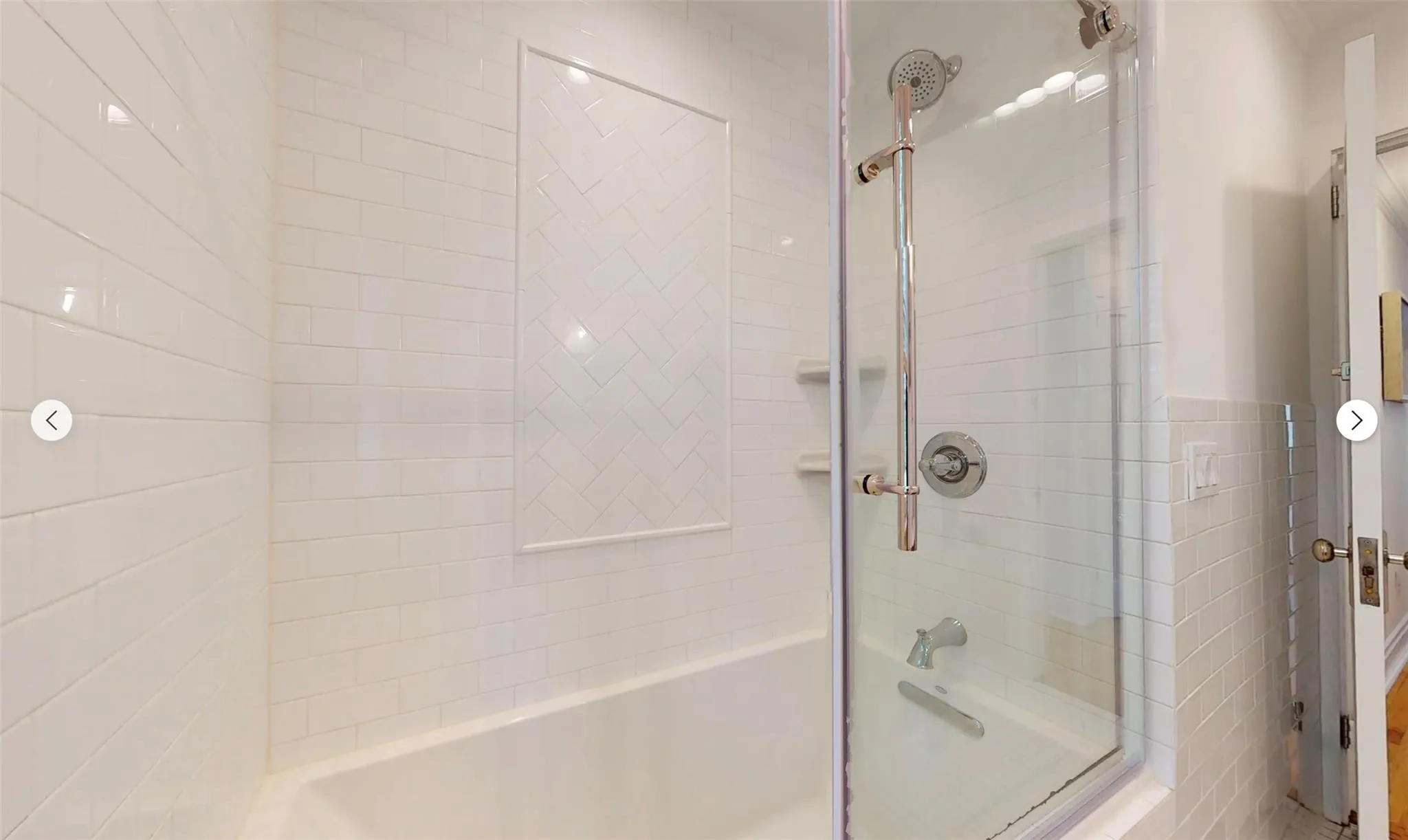 Bathroom featuring shower / bath combination with glass door Bathroom featuring shower / bath combination with glass door