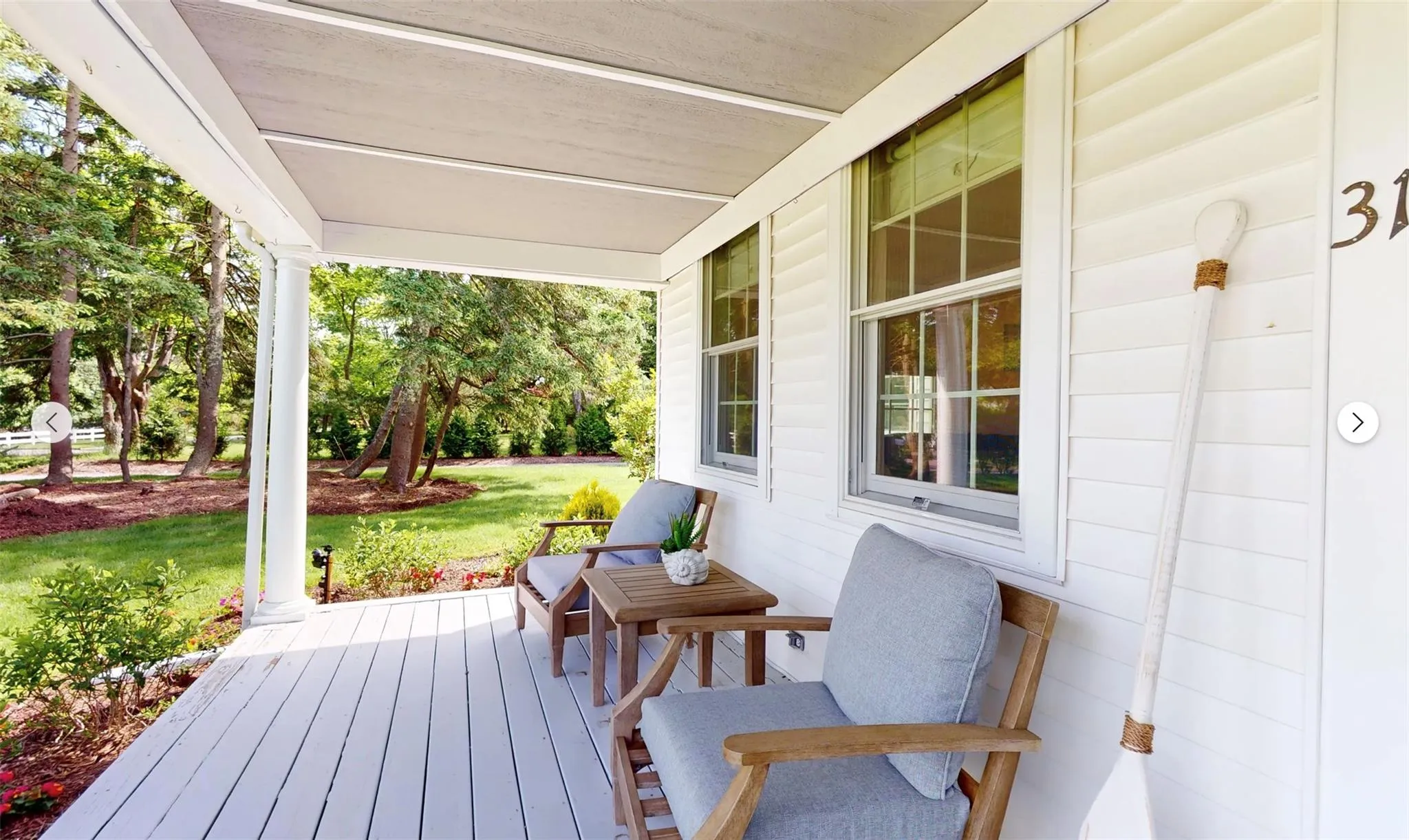 Wooden deck featuring covered porch Wooden deck featuring covered porch
