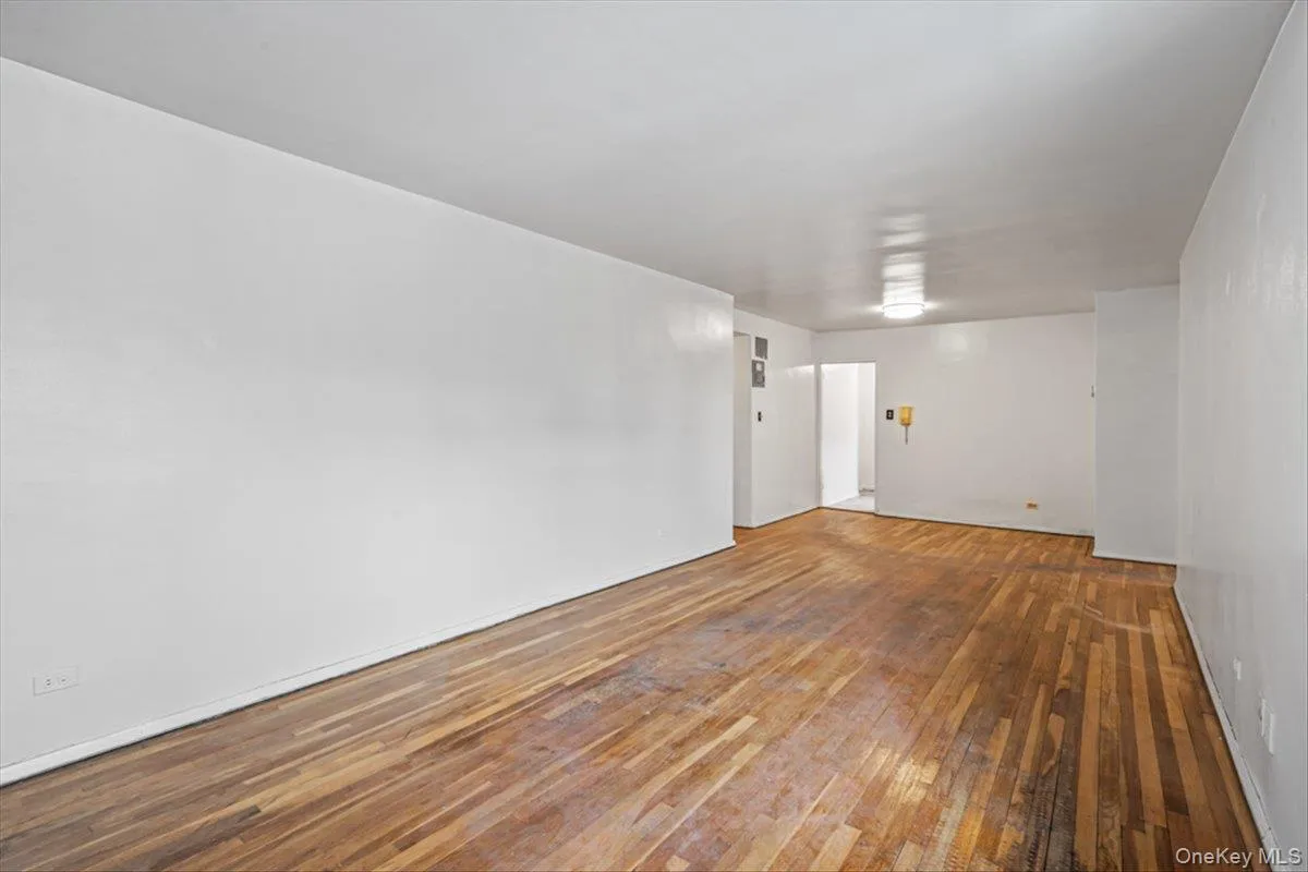 Unfurnished room with hardwood / wood-style floors Unfurnished room with hardwood / wood-style floors