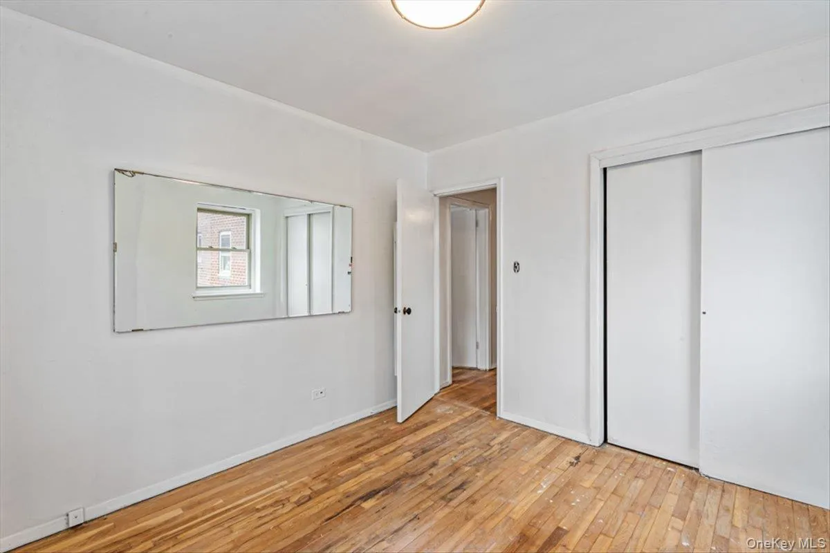Unfurnished bedroom featuring light hardwood / wood-style floors and a closet Unfurnished bedroom featuring light hardwood / wood-style floors and a closet