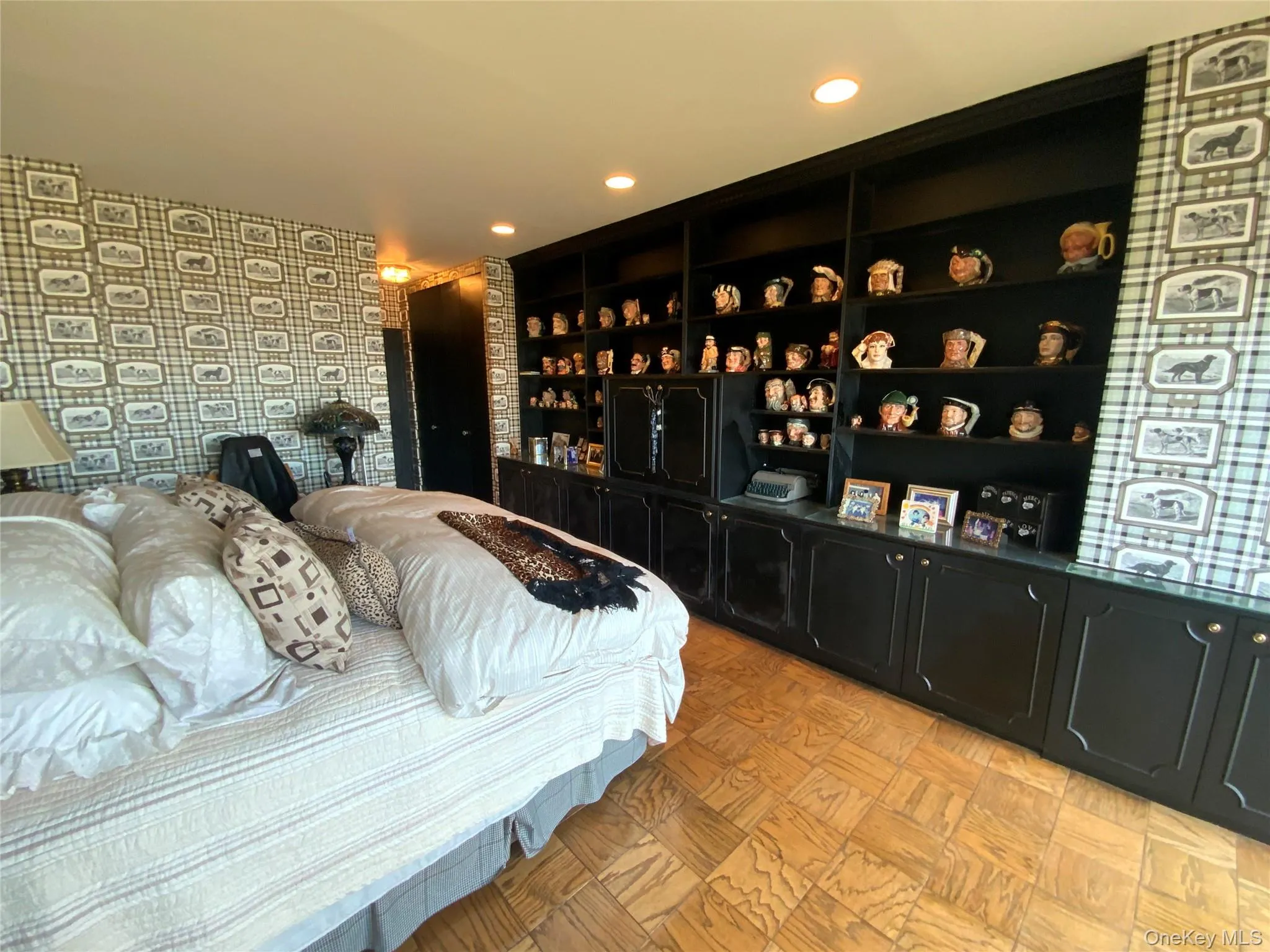 Bedroom featuring wallpapered walls and recessed lighting Bedroom featuring wallpapered walls and recessed lighting
