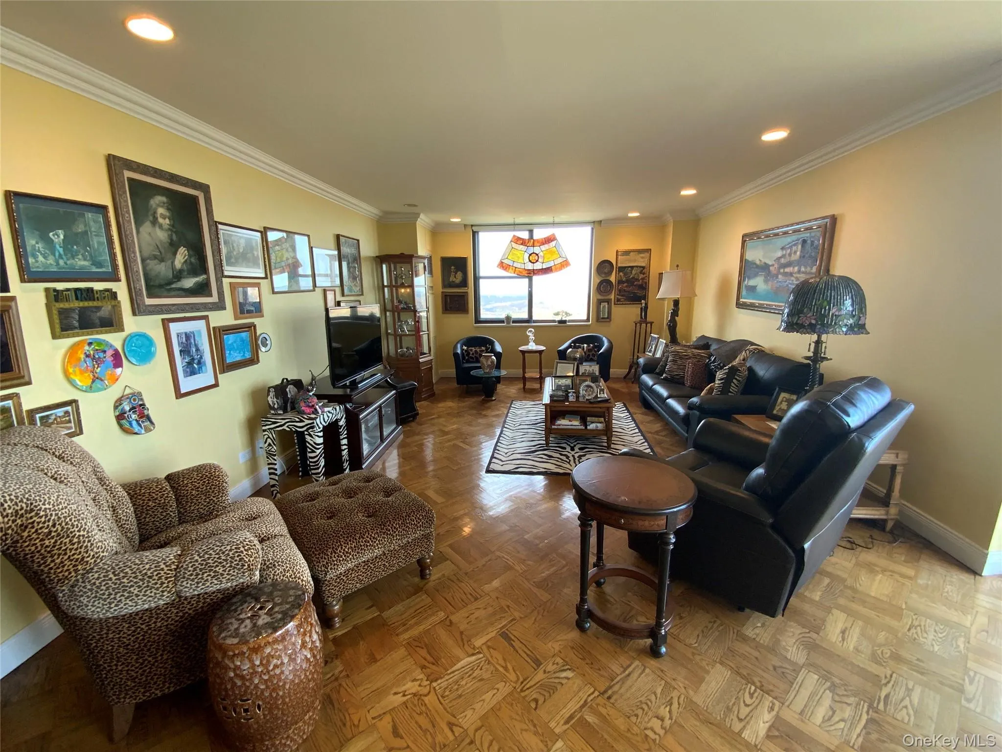 Living room with recessed lighting and ornamental molding Living room with recessed lighting and ornamental molding
