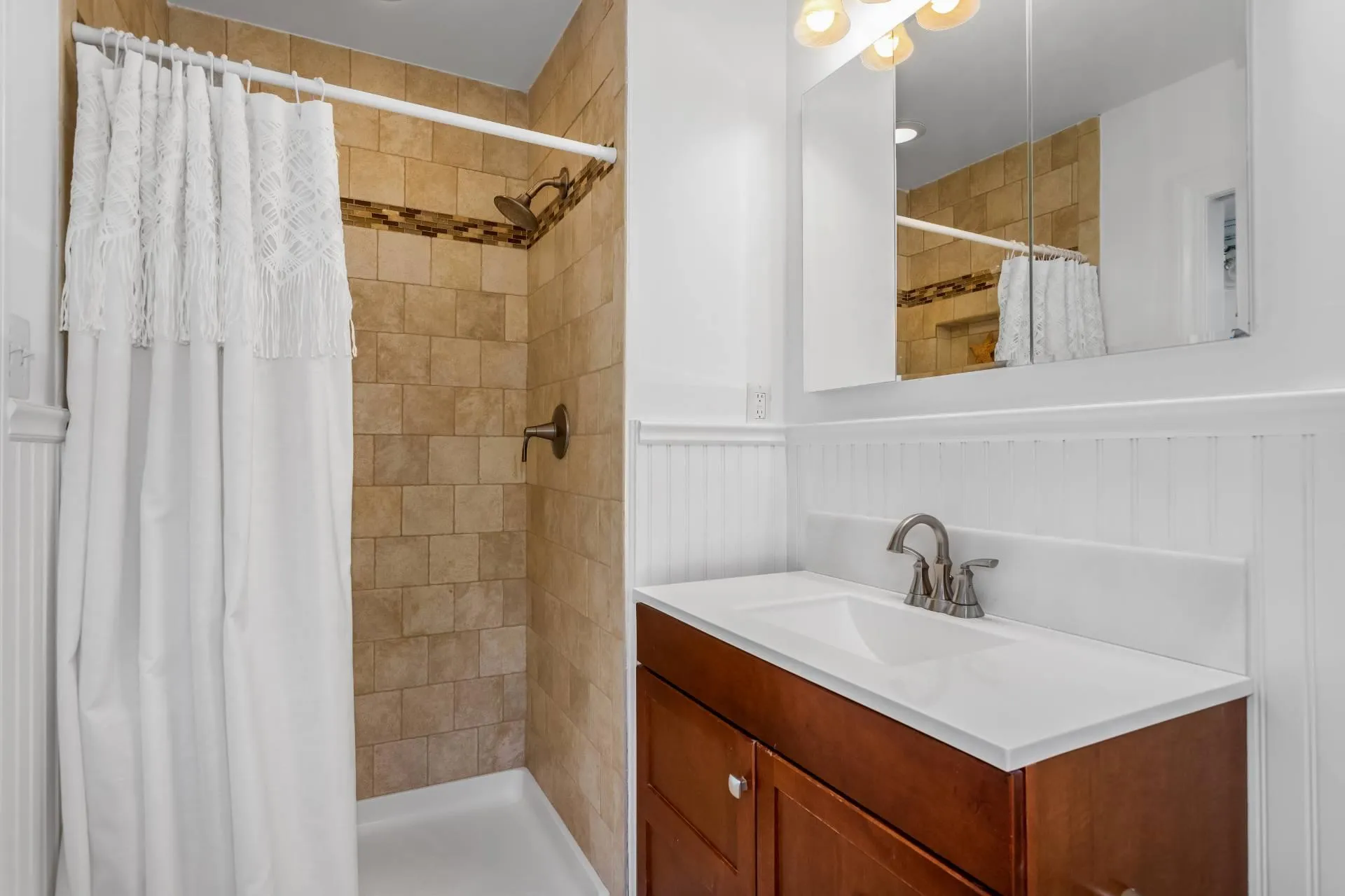 Bathroom featuring vanity and curtained shower Bathroom featuring vanity and curtained shower