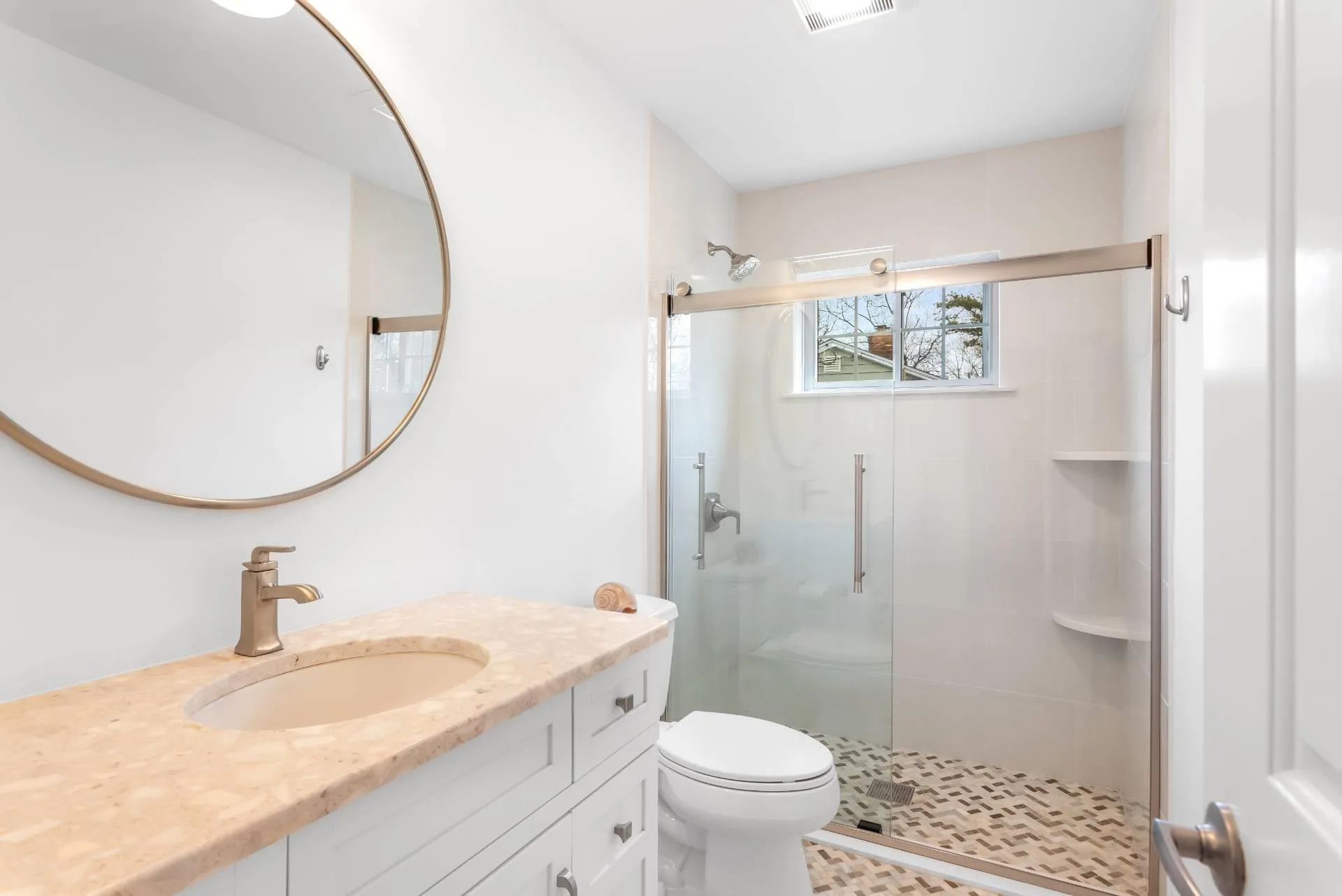 Bathroom with vanity, an enclosed shower, and toilet Bathroom with vanity, an enclosed shower, and toilet