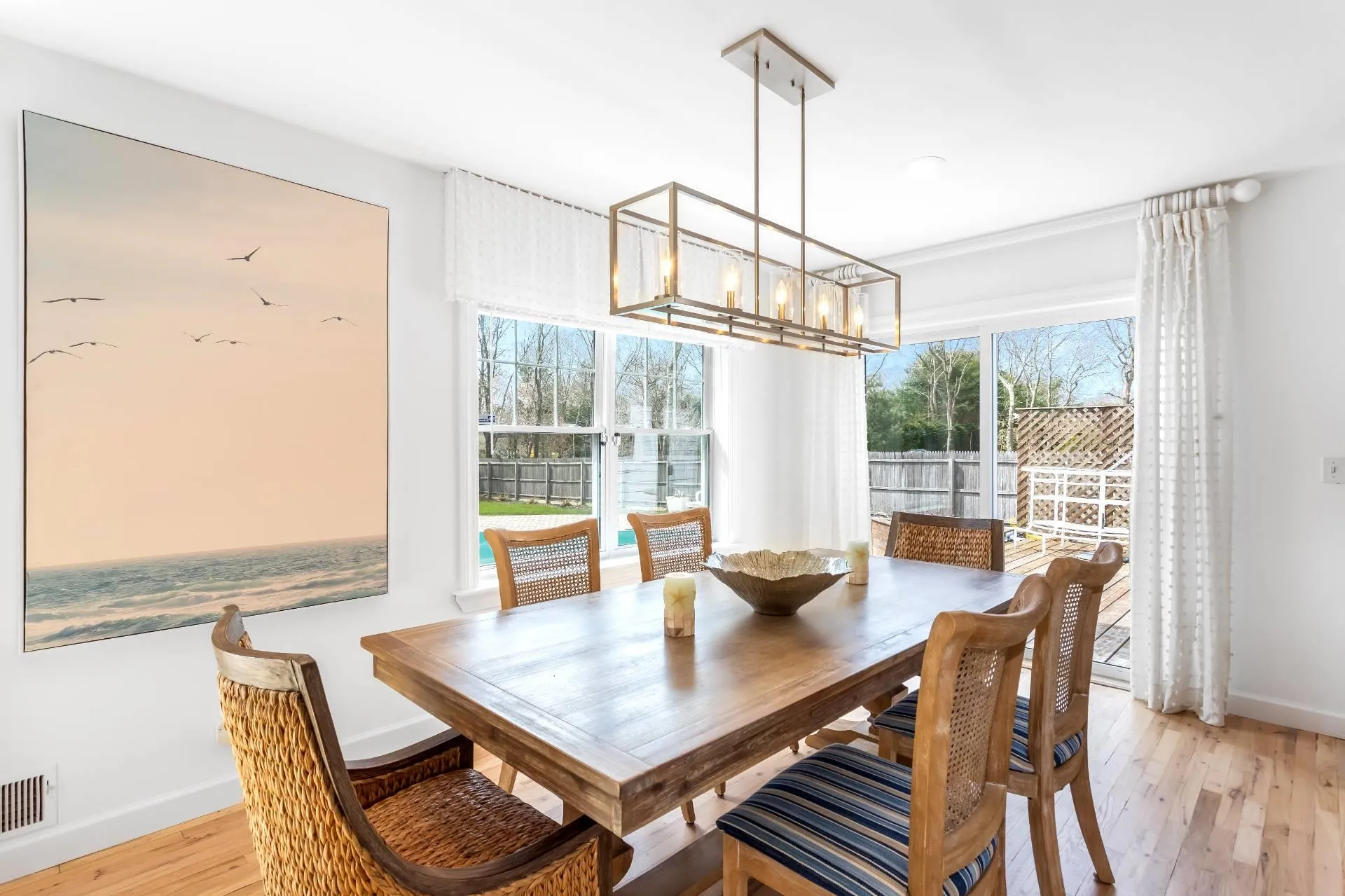 Dining space featuring an inviting chandelier and light wood-type flooring Dining space featuring an inviting chandelier and light wood-type flooring
