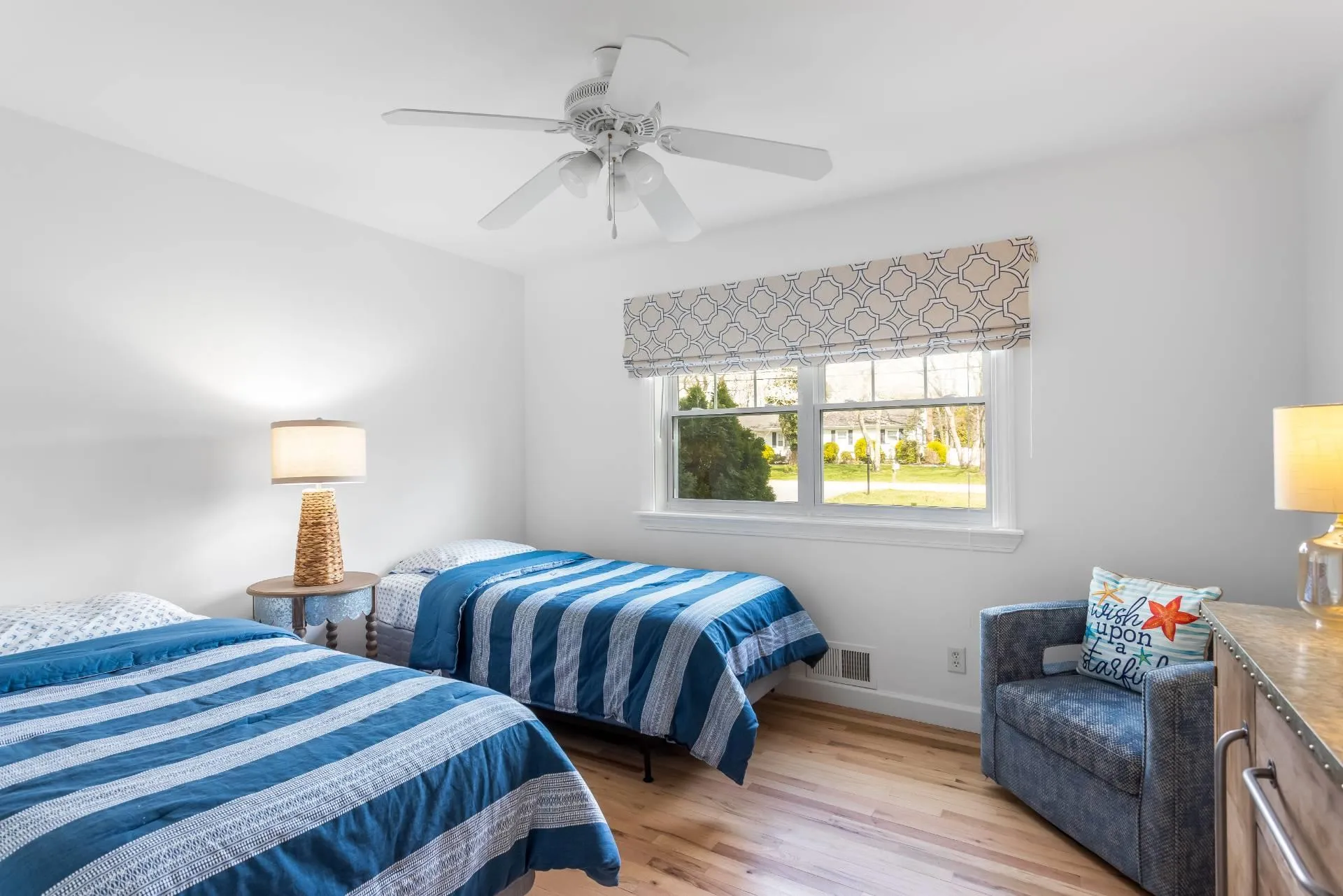 Bedroom with light hardwood / wood-style floors and ceiling fan Bedroom with light hardwood / wood-style floors and ceiling fan