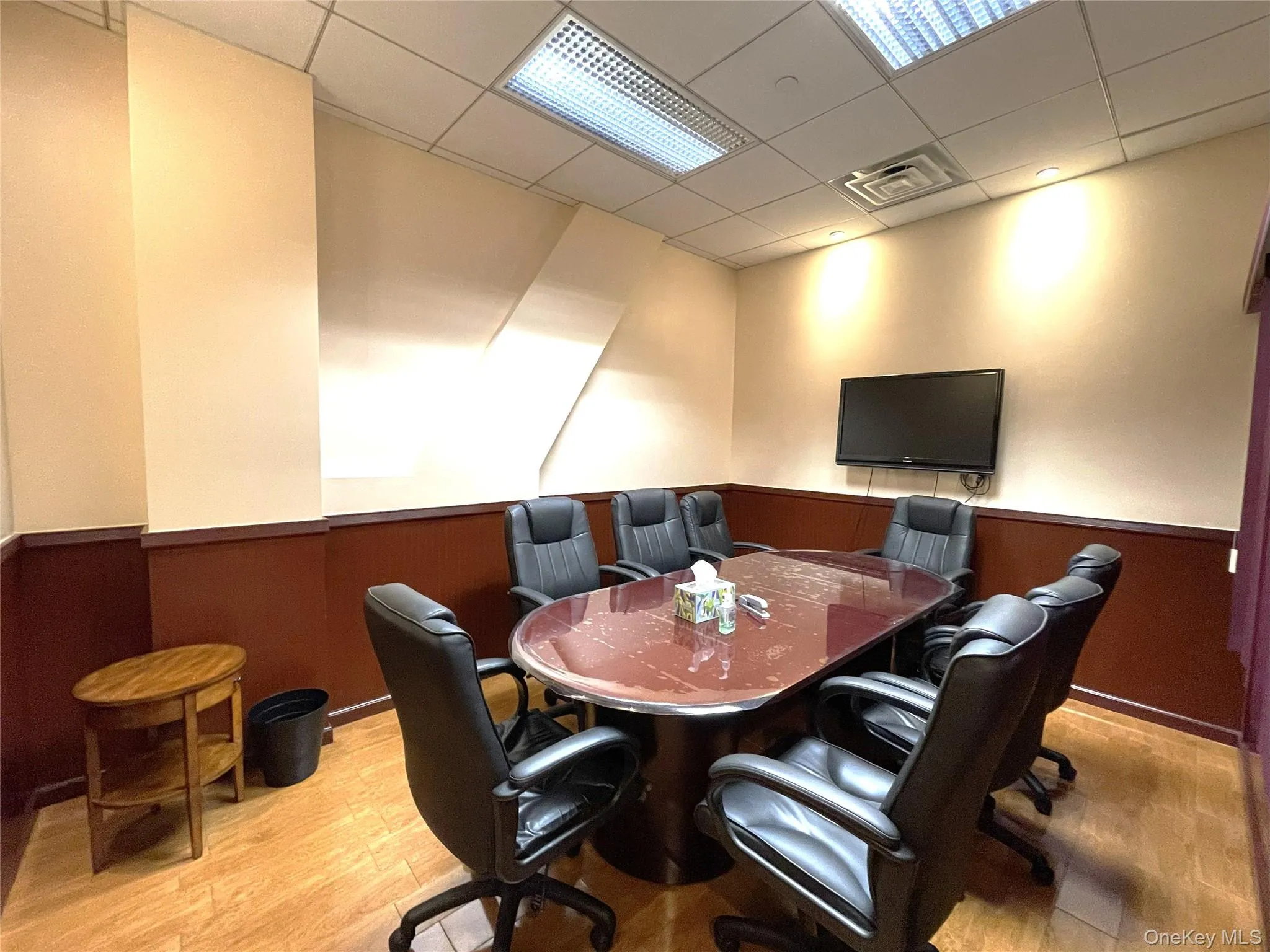 Home office featuring wainscoting, a paneled ceiling, and wood walls Home office featuring wainscoting, a paneled ceiling, and wood walls