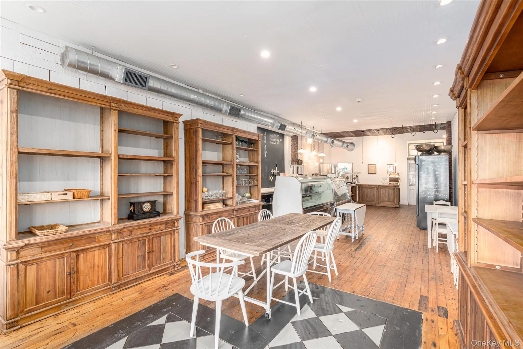 Dining space featuring hardwood / wood-style flooring Dining space featuring hardwood / wood-style flooring