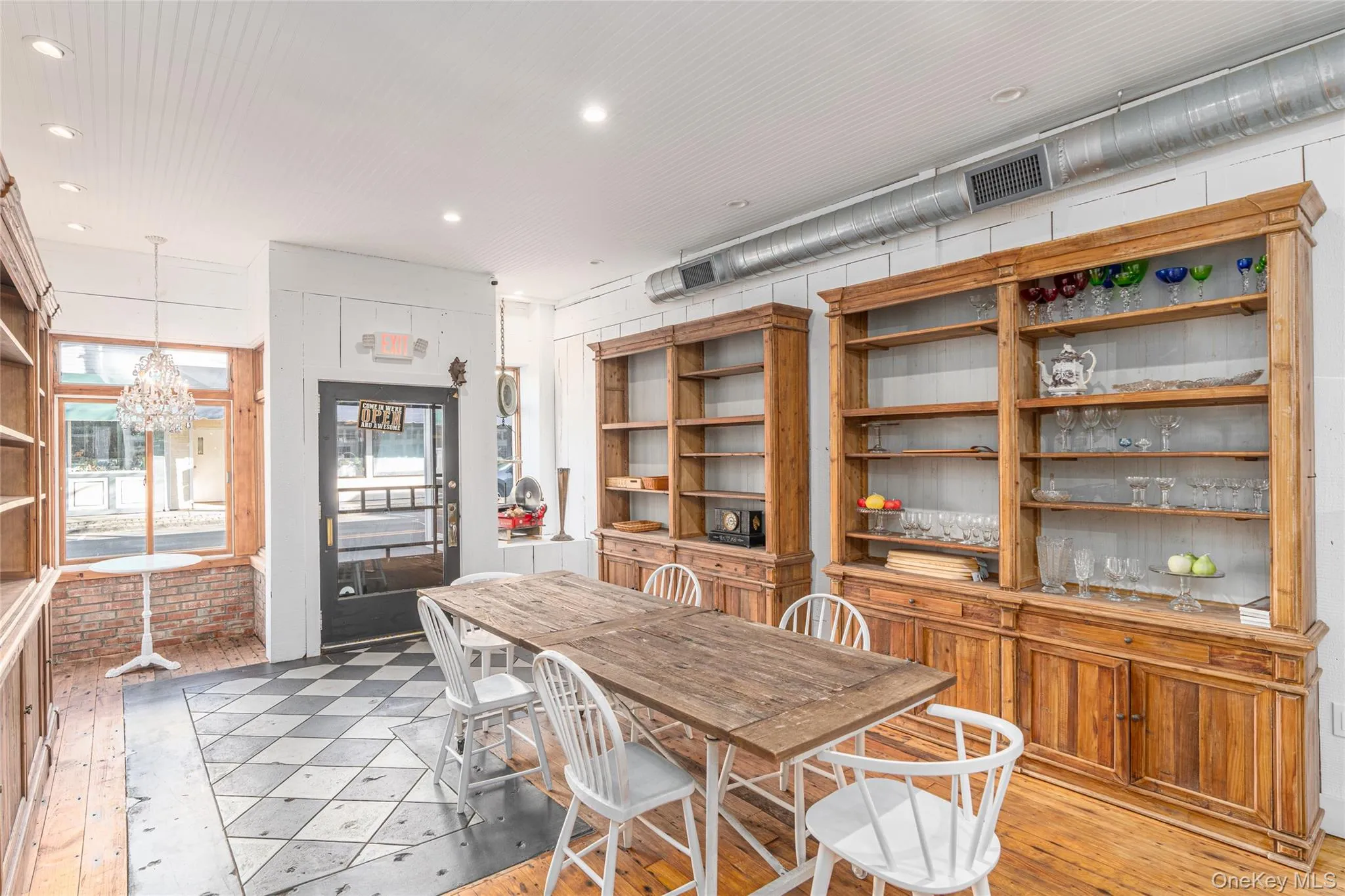 Dining area featuring a notable chandelier Dining area featuring a notable chandelier