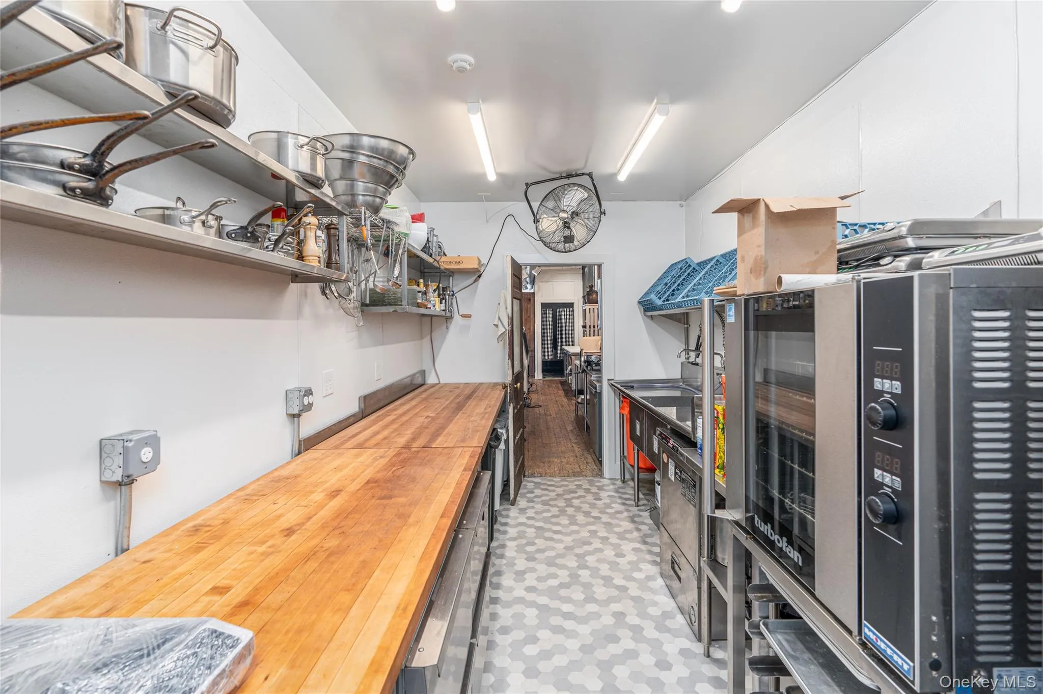 Kitchen with dishwashing machine and wood counters Kitchen with dishwashing machine and wood counters