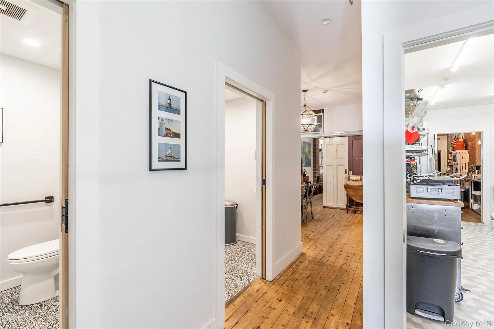 Hallway with light hardwood / wood-style floors Hallway with light hardwood / wood-style floors