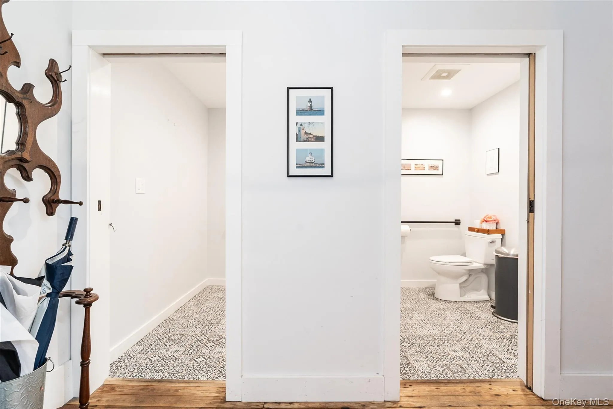 Bathroom featuring hardwood / wood-style flooring and toilet Bathroom featuring hardwood / wood-style flooring and toilet