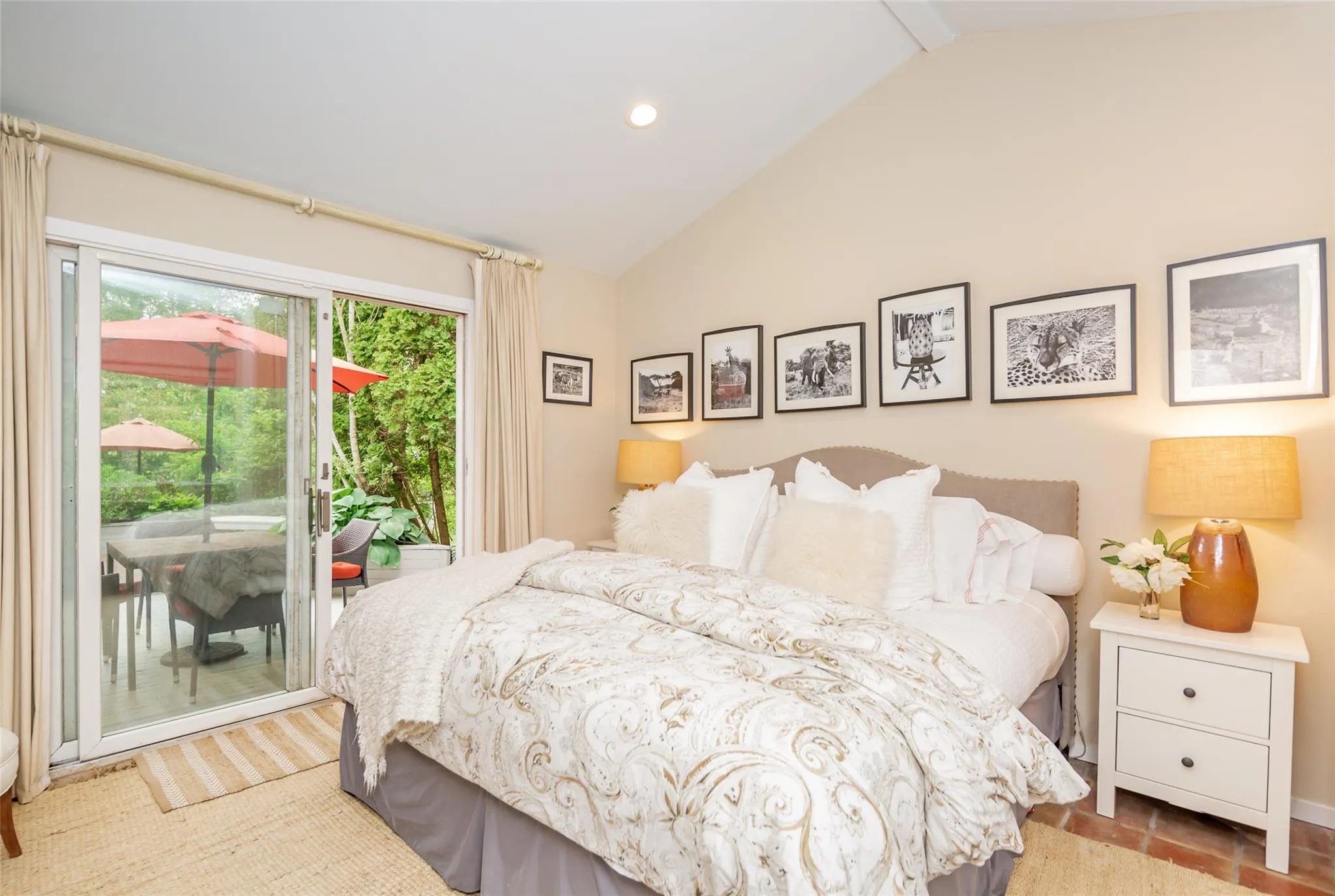 Bedroom featuring recessed lighting, beam ceiling, high vaulted ceiling, and access to outside Bedroom featuring recessed lighting, beam ceiling, high vaulted ceiling, and access to outside