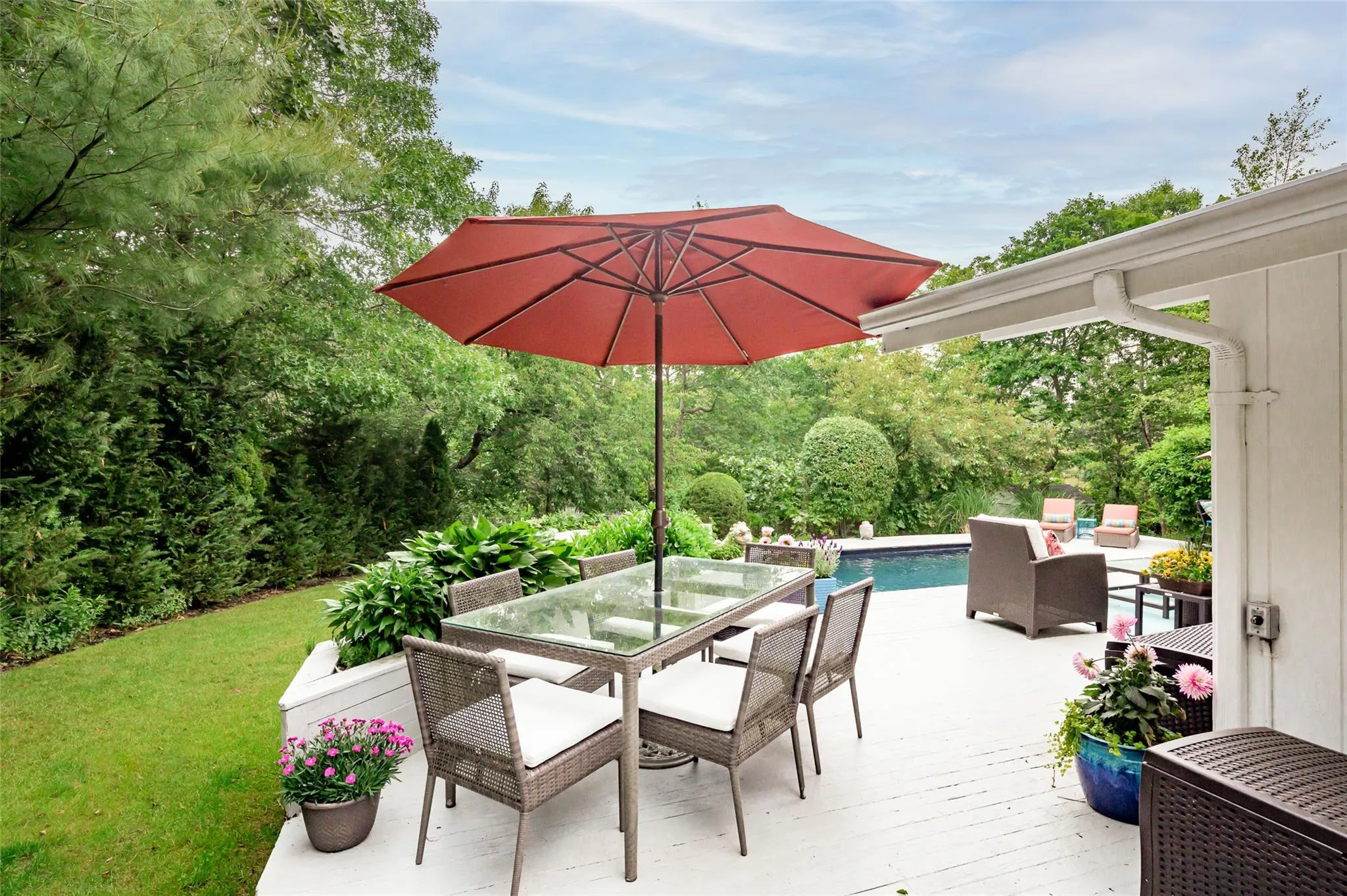 View of patio / terrace with a wooden deck, an outdoor pool, and outdoor dining area View of patio / terrace with a wooden deck, an outdoor pool, and outdoor dining area