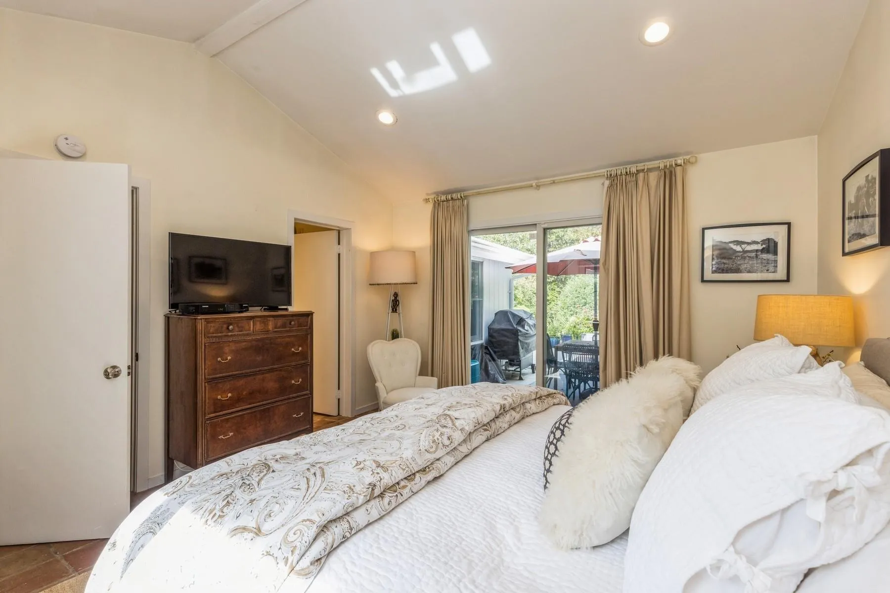 Bedroom with lofted ceiling and access to exterior Bedroom with lofted ceiling and access to exterior