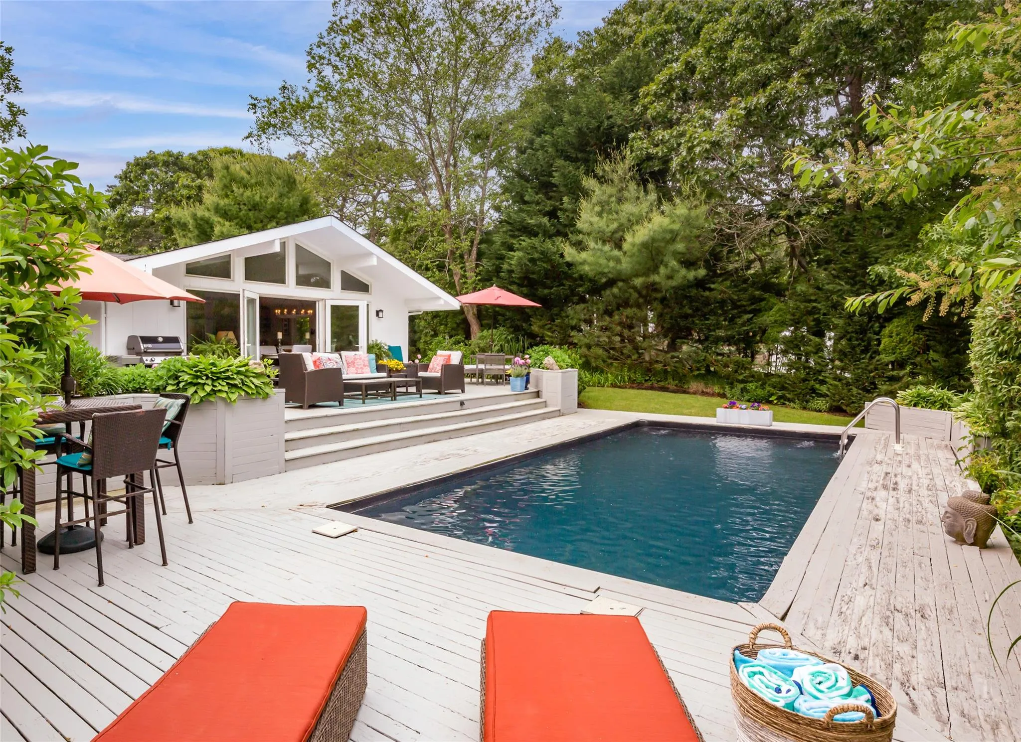 Outdoor pool featuring a deck, outdoor dining space, an outdoor structure, and an outdoor living space Outdoor pool featuring a deck, outdoor dining space, an outdoor structure, and an outdoor living space
