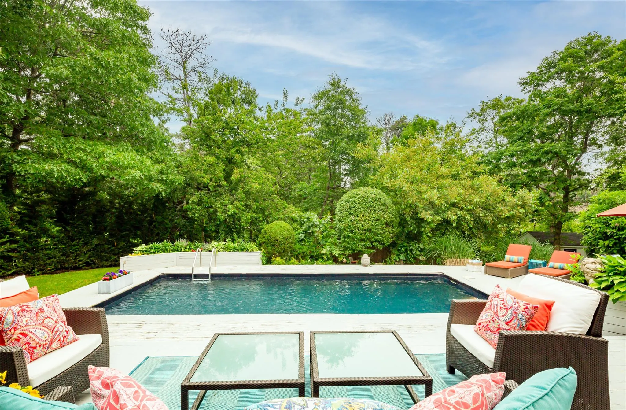 Pool with an outdoor hangout area Pool with an outdoor hangout area