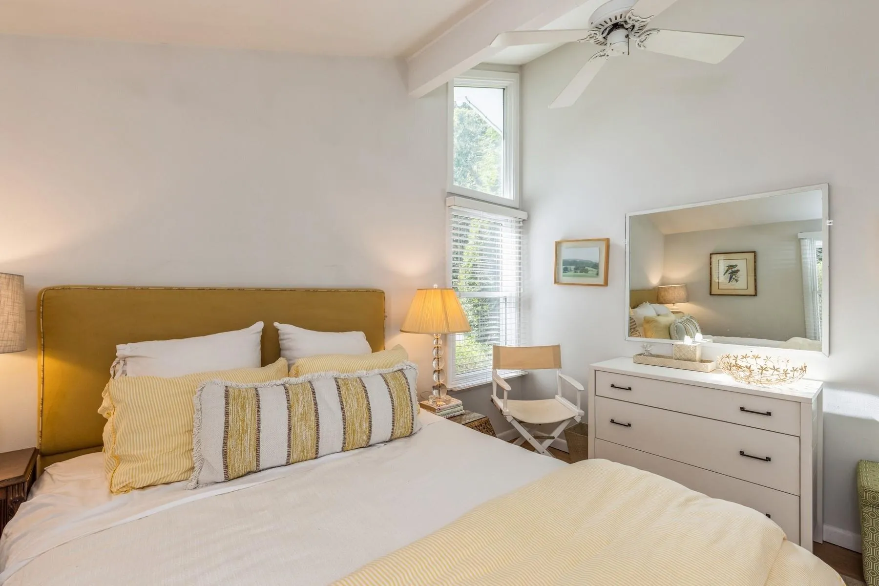 Bedroom featuring a high ceiling, ceiling fan, and beam ceiling - Queen Bed Bedroom featuring a high ceiling, ceiling fan, and beam ceiling - Queen Bed