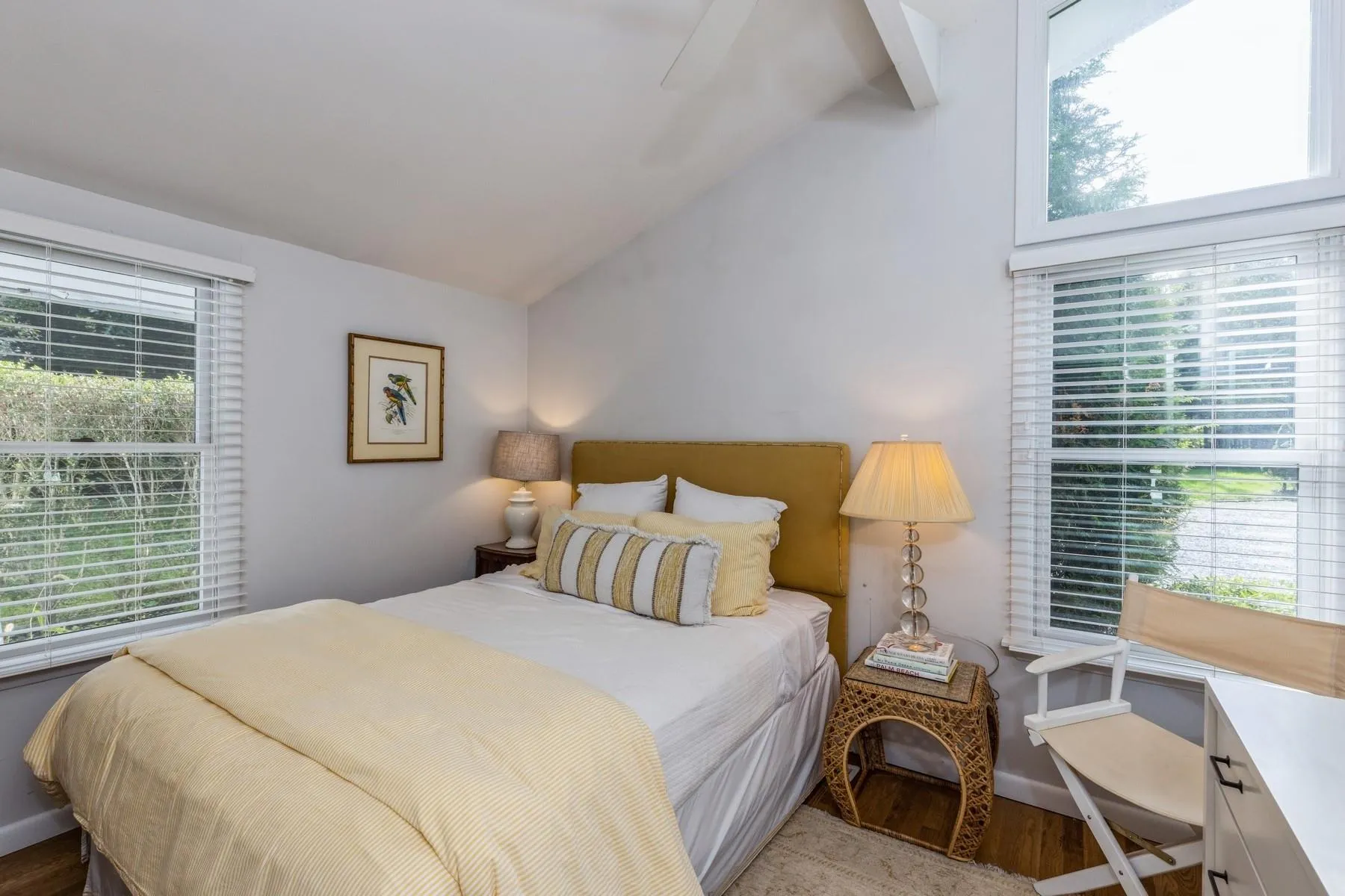 Bedroom with lofted ceiling, light hardwood / wood-style flooring, and ceiling fan Bedroom with lofted ceiling, light hardwood / wood-style flooring, and ceiling fan