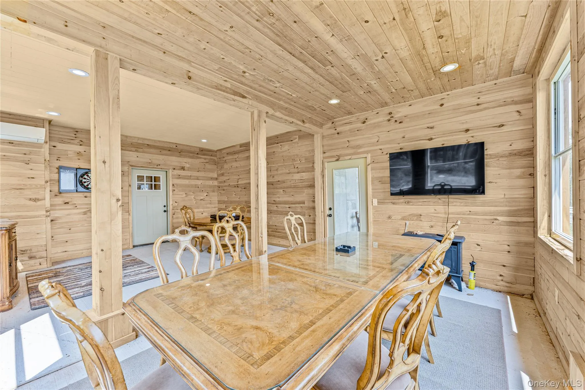 Entertainment area featuring wooden walls, recessed lighting, and wood ceiling Entertainment area featuring wooden walls, recessed lighting, and wood ceiling