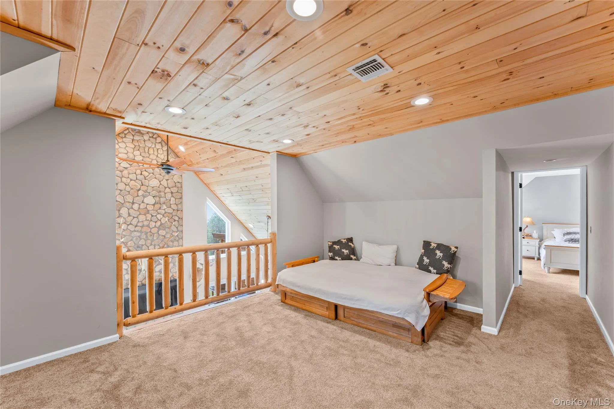 Family room with vaulted ceiling, carpet flooring, recessed lighting, and wooden ceiling Family room with vaulted ceiling, carpet flooring, recessed lighting, and wooden ceiling