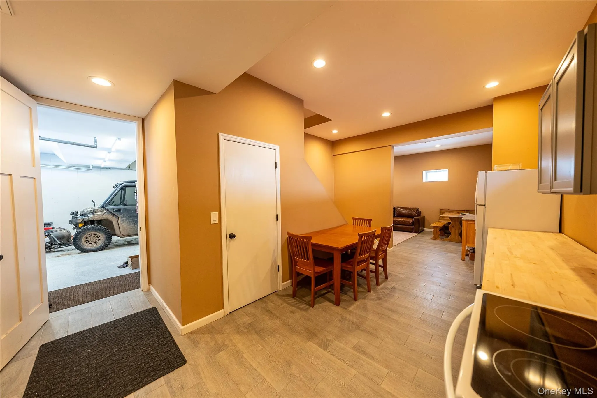 Kitchenette area featuring light hardwood / wood-style flooring Kitchenette area featuring light hardwood / wood-style flooring