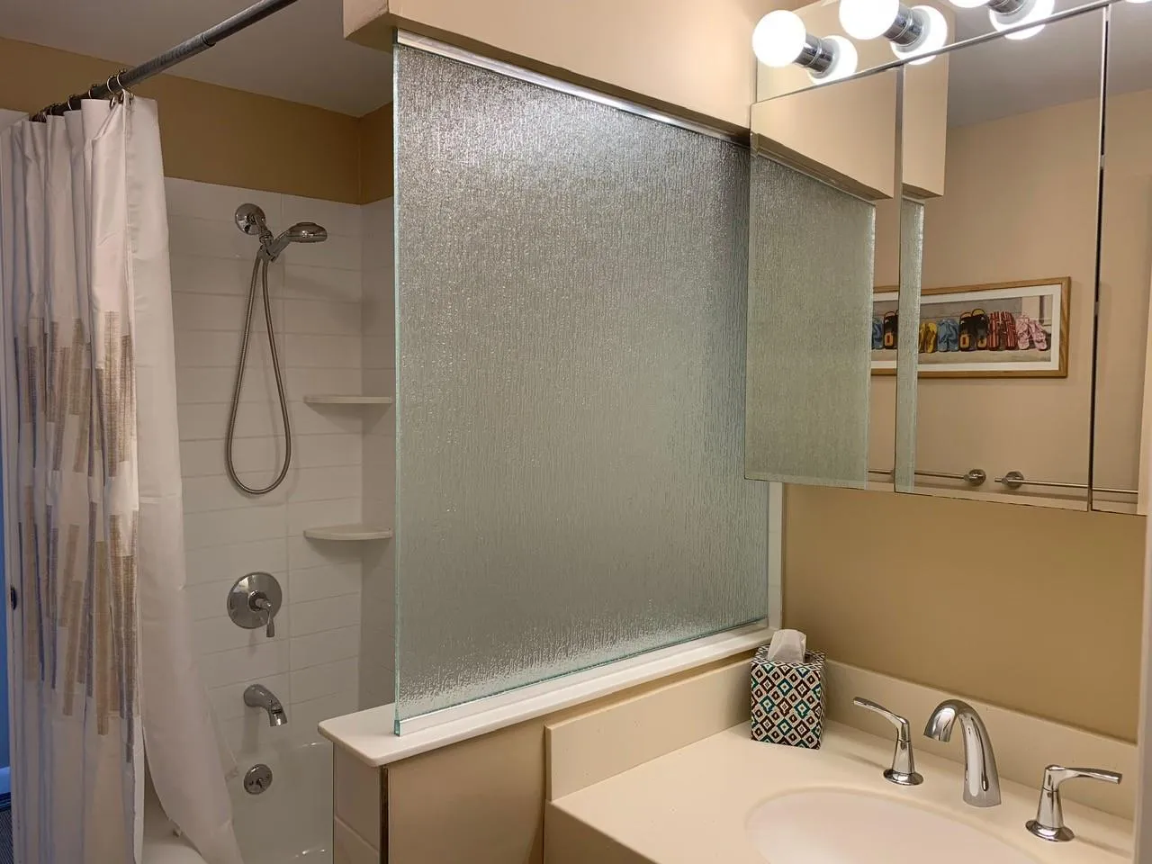 Bathroom with sink and shower / bath combination with curtain Bathroom with sink and shower / bath combination with curtain