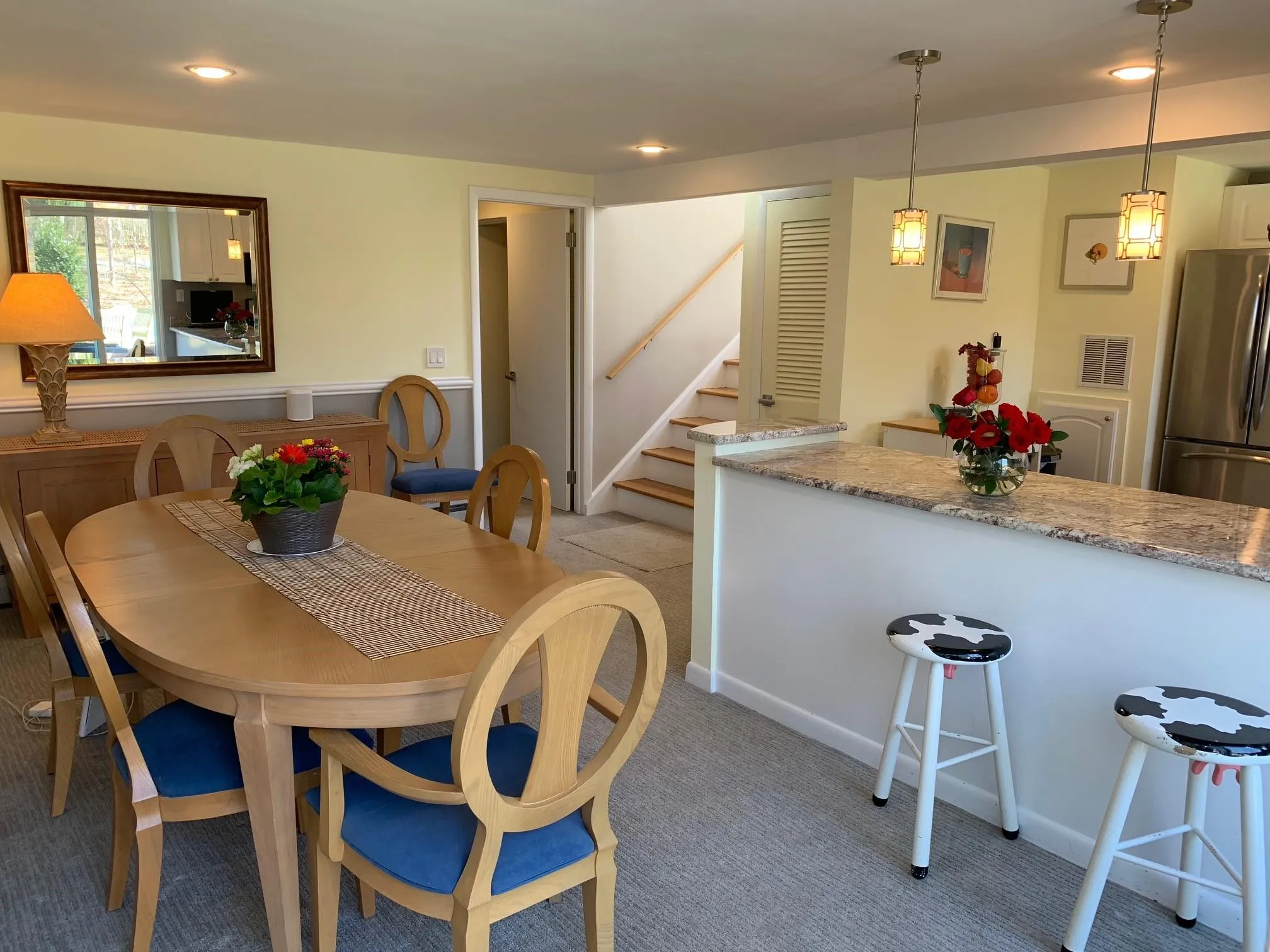 Dining room with light carpet Dining room with light carpet
