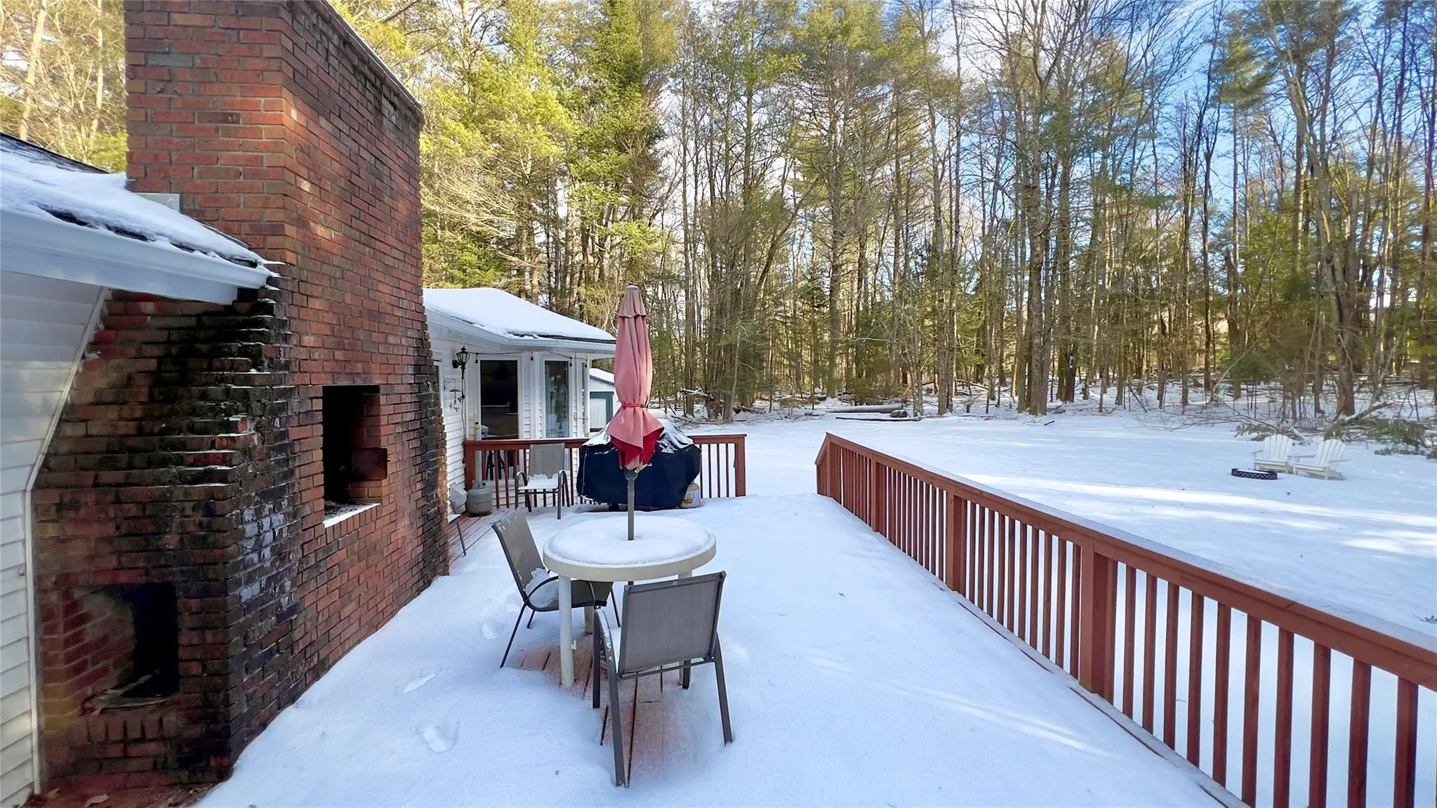 Snow covered patio with a fireplace Snow covered patio with a fireplace