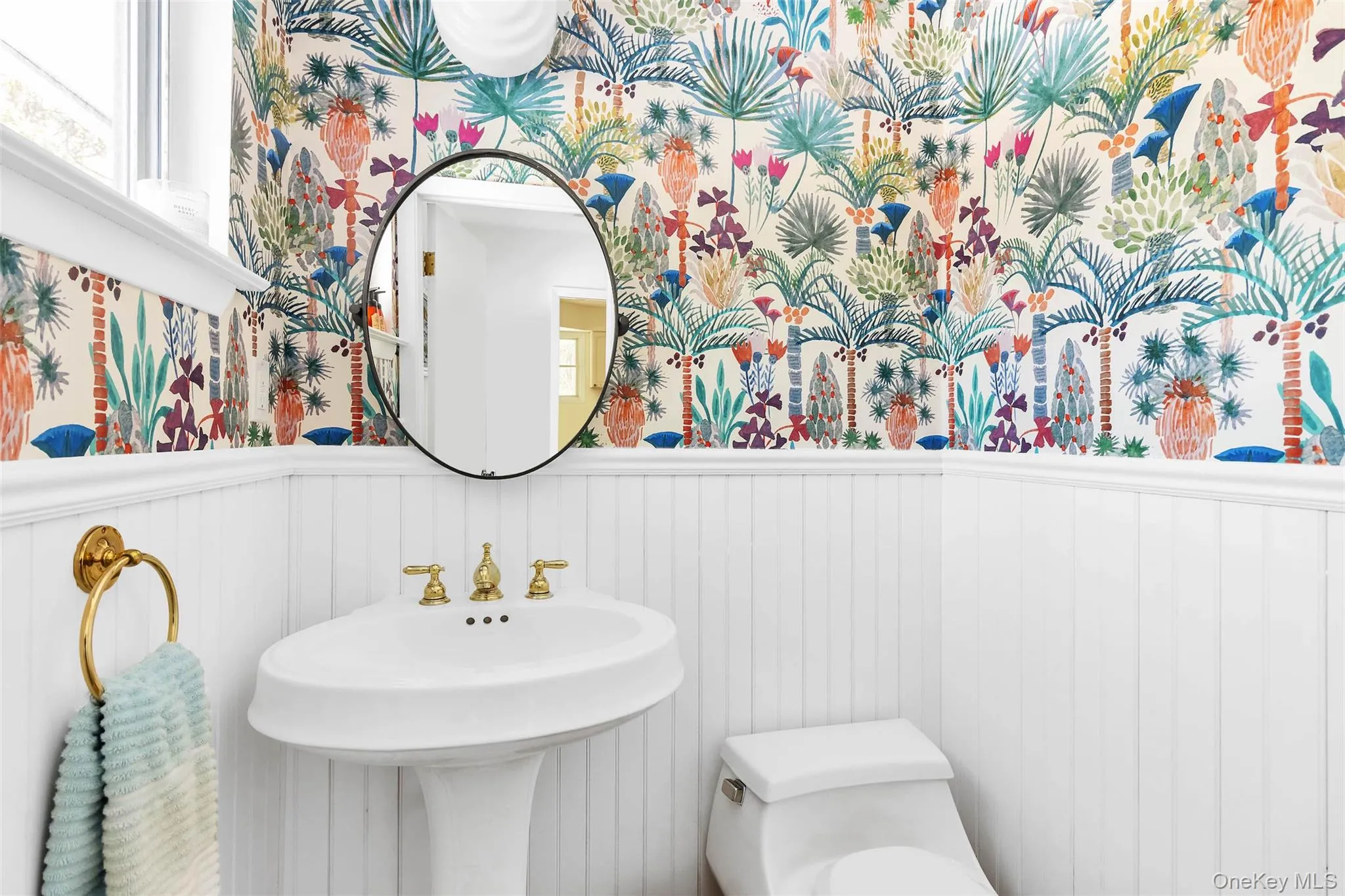 Bathroom featuring toilet and sink Bathroom featuring toilet and sink